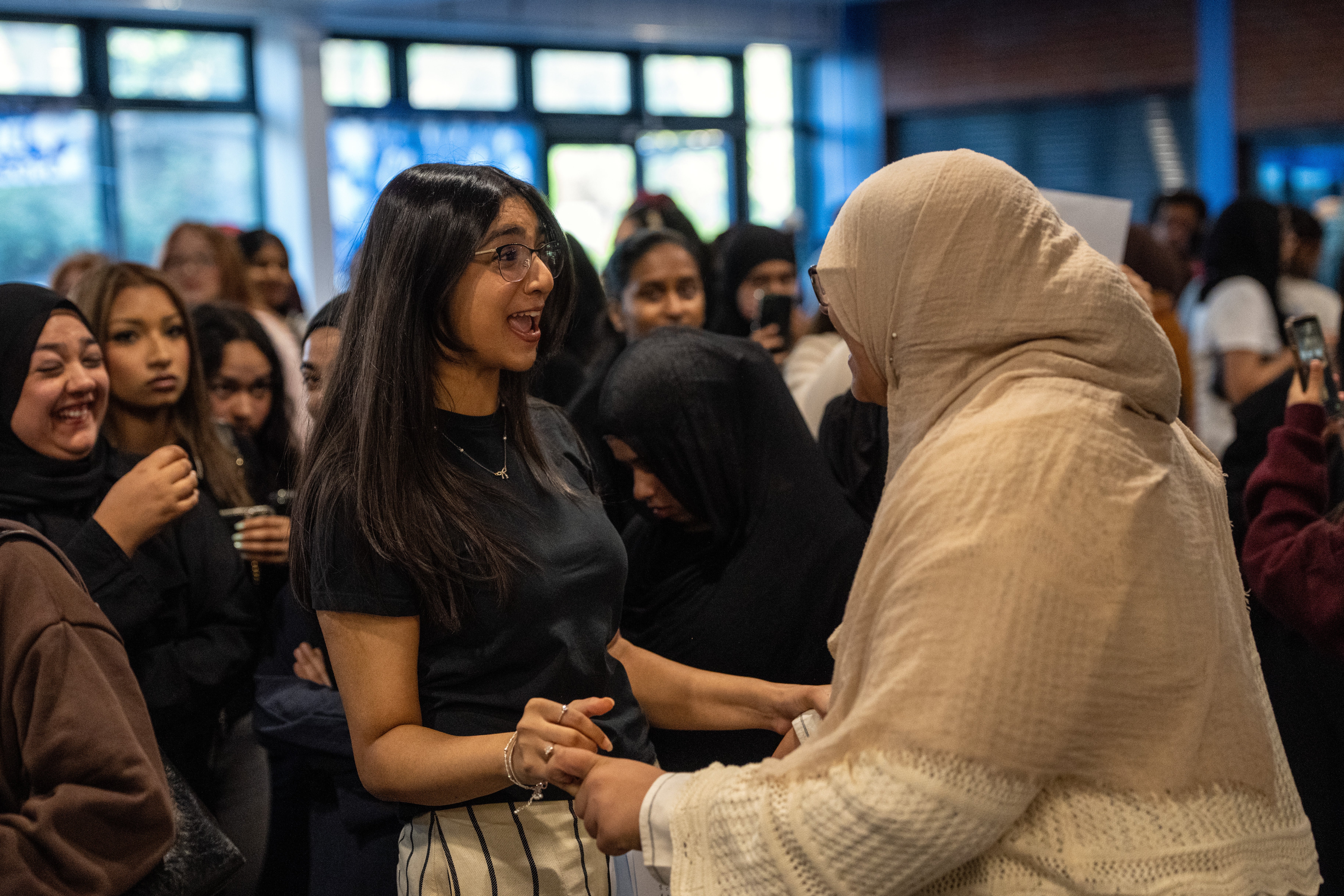 Pupils celebrate after receiving their GCSE results at Plashet City of London Academy