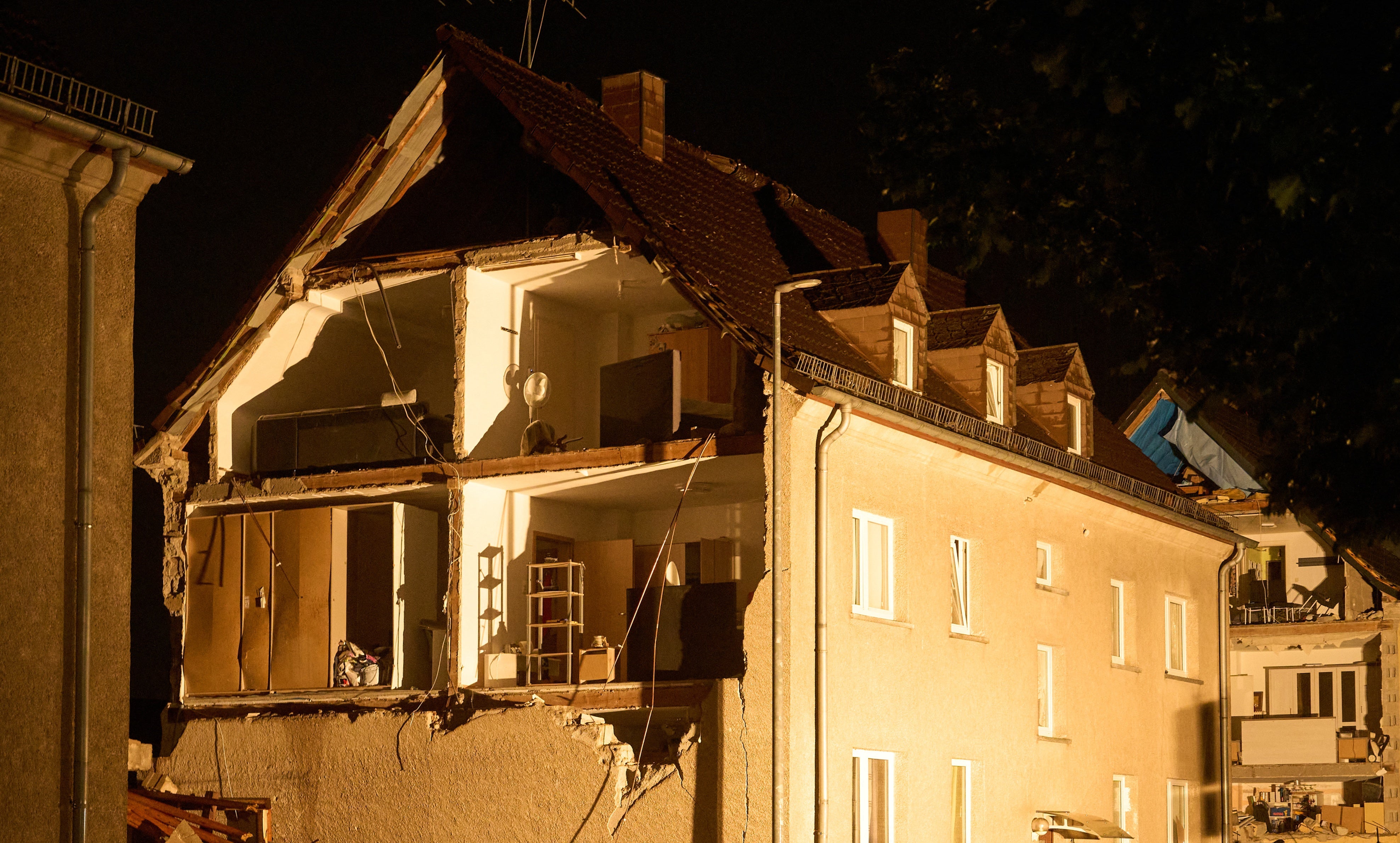 Houses are seen severely damaged following a violent thunderstorm, in Höhr-Grenzhausen, Germany, Wednesday, Aug. 19, 2026. (Thomas Frey/dpa via AP)