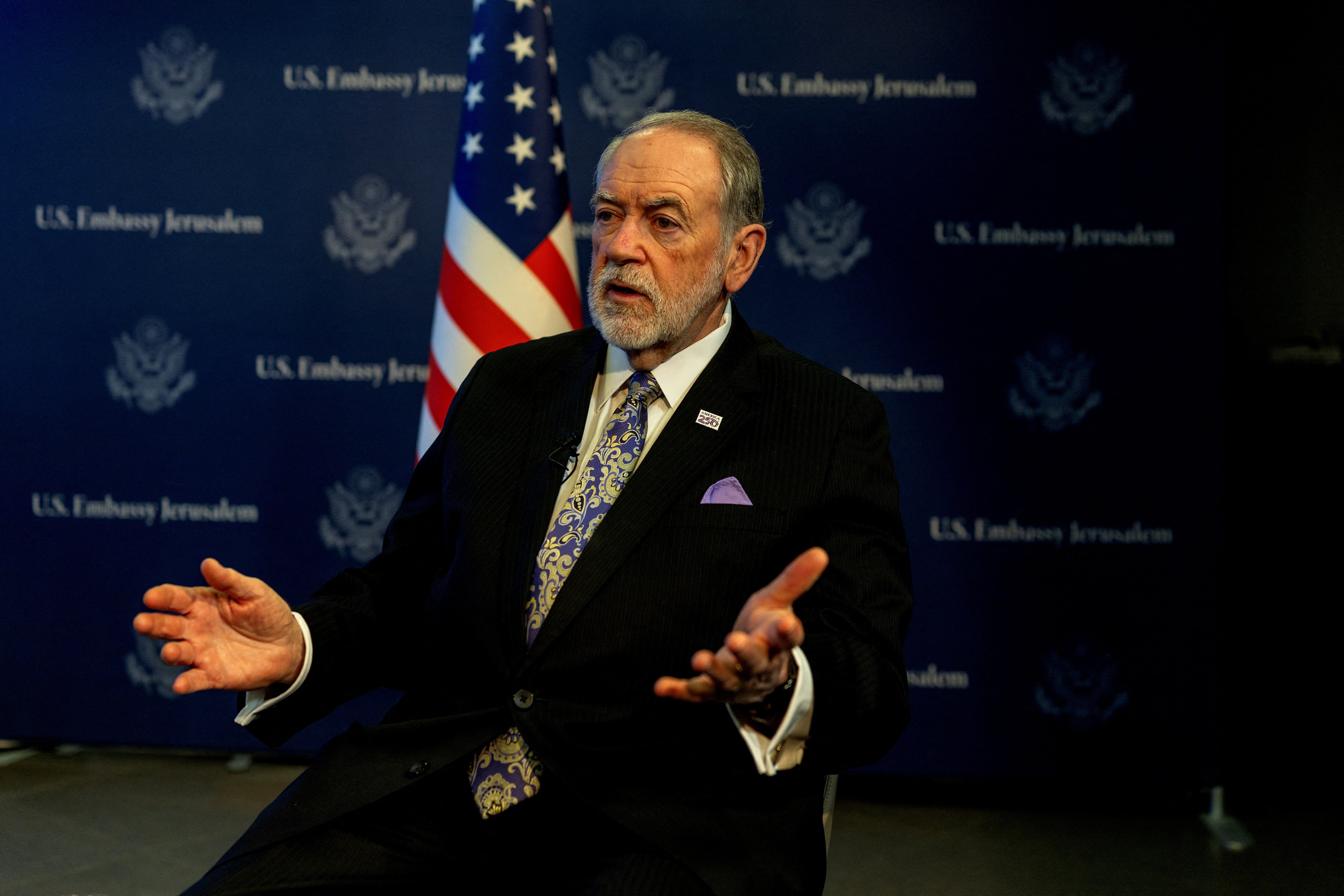 Huckabee looks on during an interview with Reuters in Jerusalem