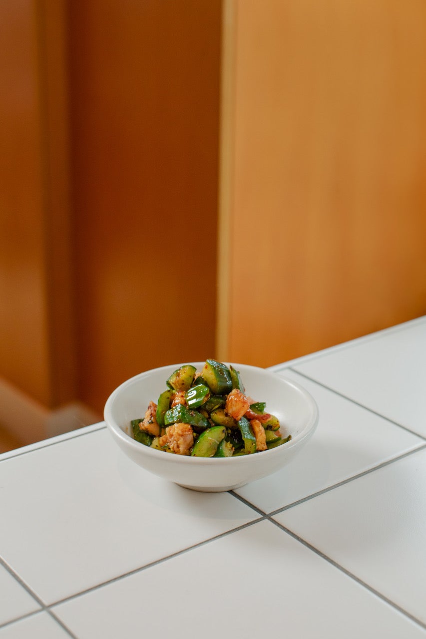 Smoked eel brings richness to crunchy cucumber dressed with black vinegar, garlic and Sichuan chilli oil
