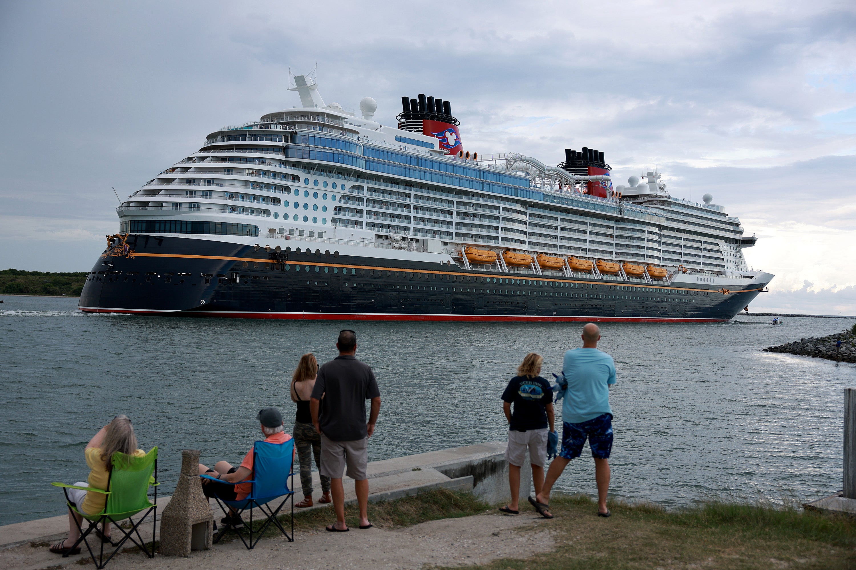 A new lawsuit claims the 'excessively bright' theater lights aboard the Disney Wish, seen here leaving Port Canveral Florida, caused a disoriented passenger to fall down the stairs
