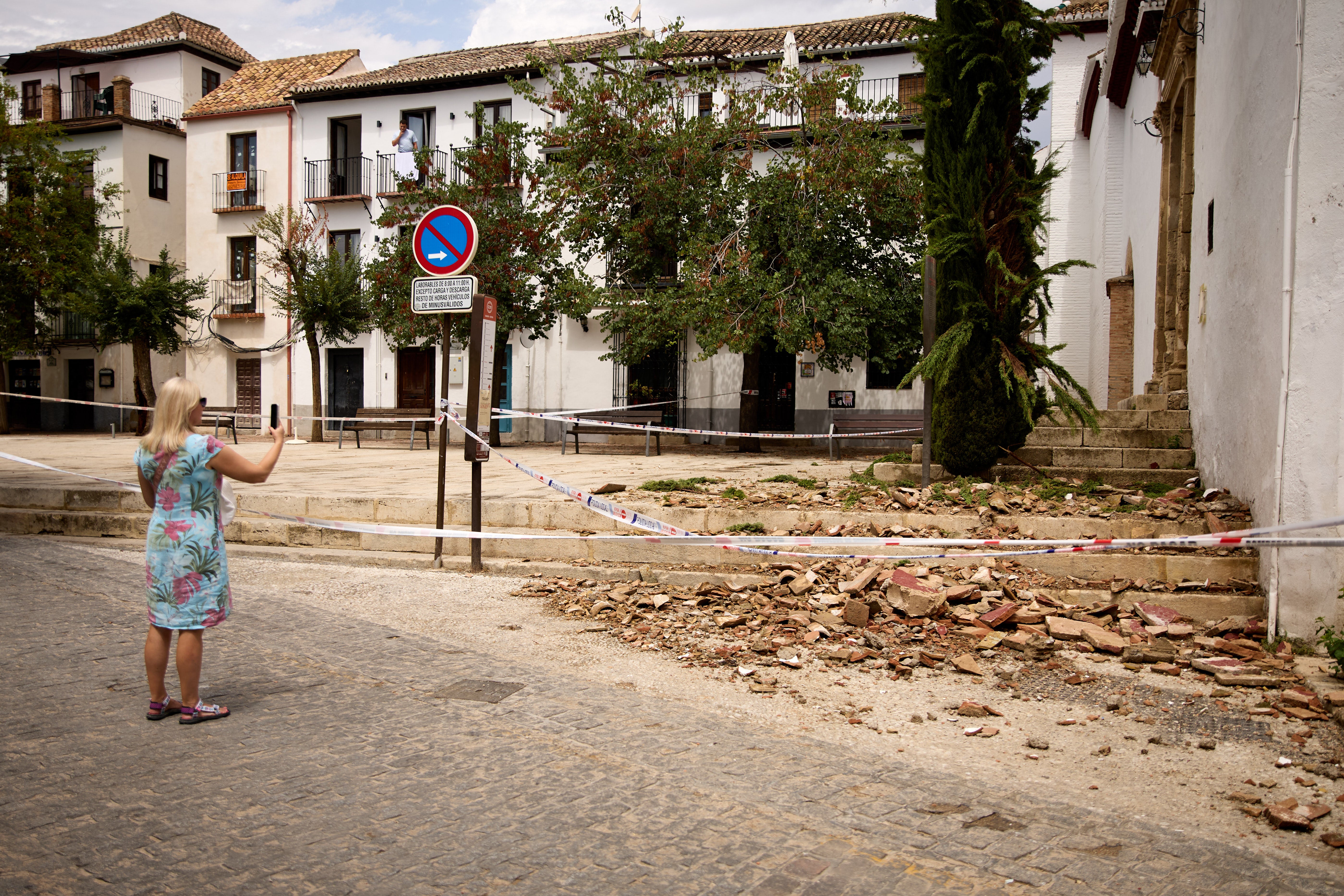 A tourist takes pictures of broken tiles at the entrance of San Miguel Bajo Church in Spain’s Granada last weekend. Experts stress that everyone should have a response plan in place before an earthquake strikes