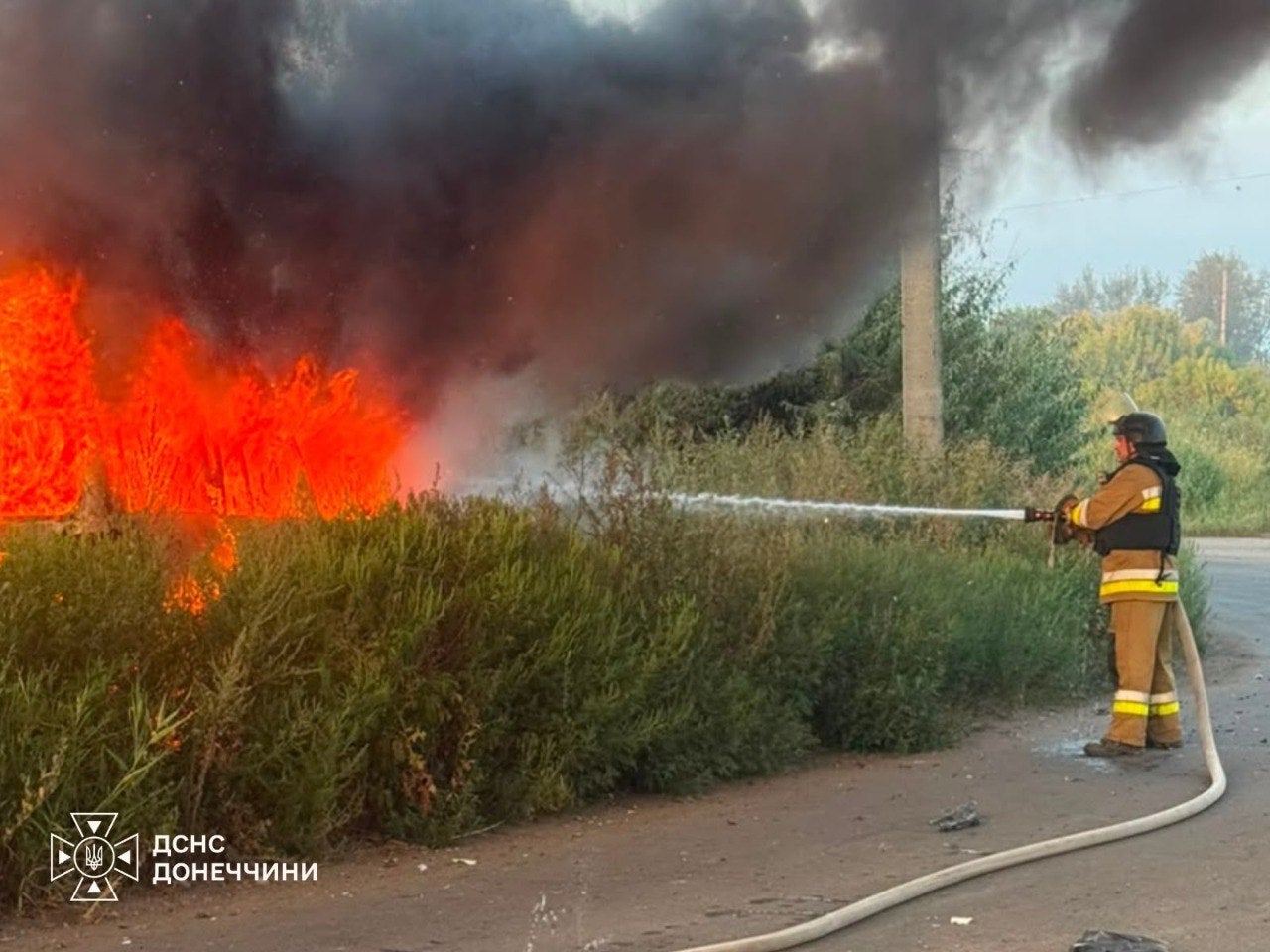 Emergency services work to put out flames after attacks in Slovyansk