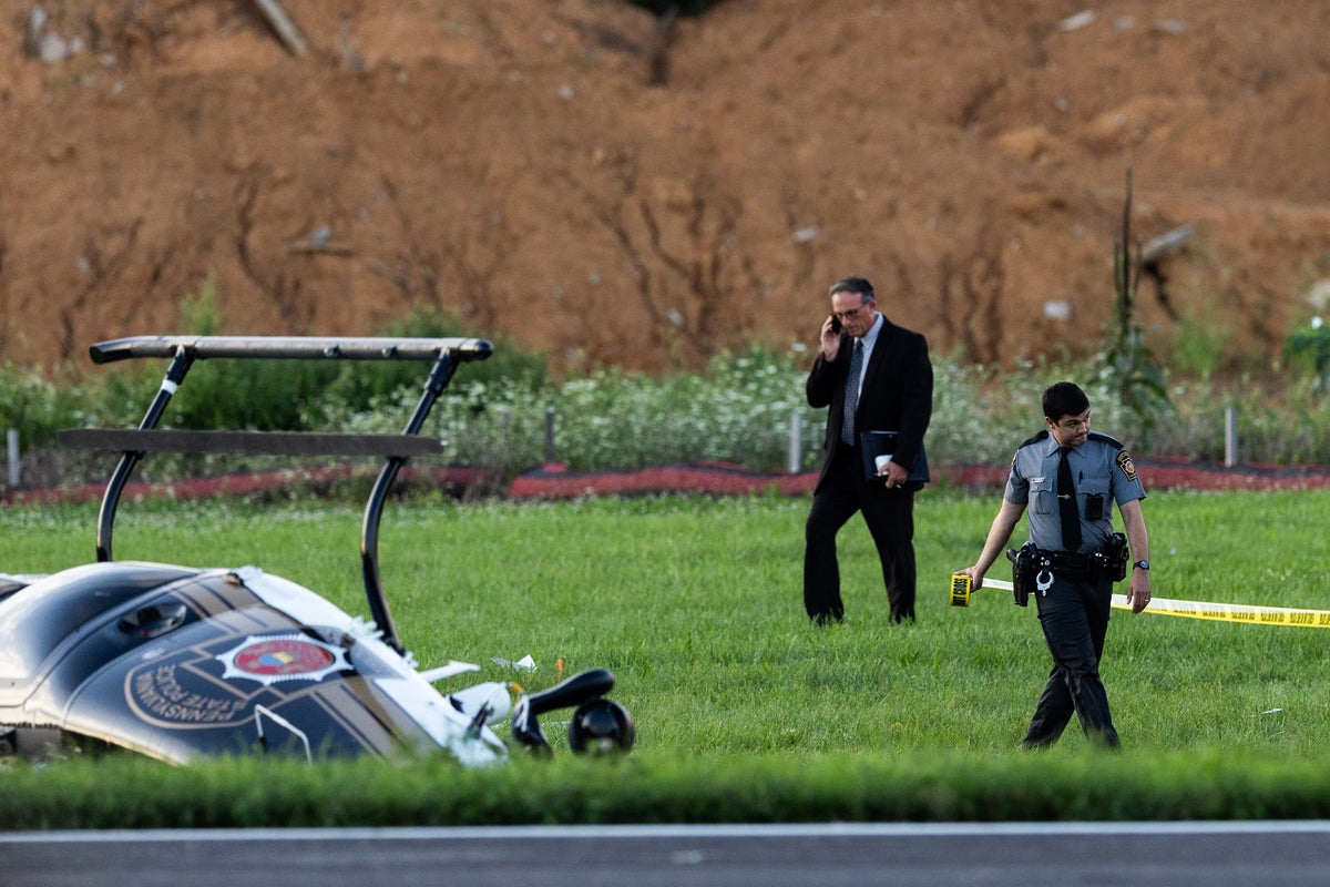 Investigators probe a dramatic midair crash as a landing plane hits hovering police helicopter Investigators probe a dramatic midair crash as a landing plane hits hovering police helicopter