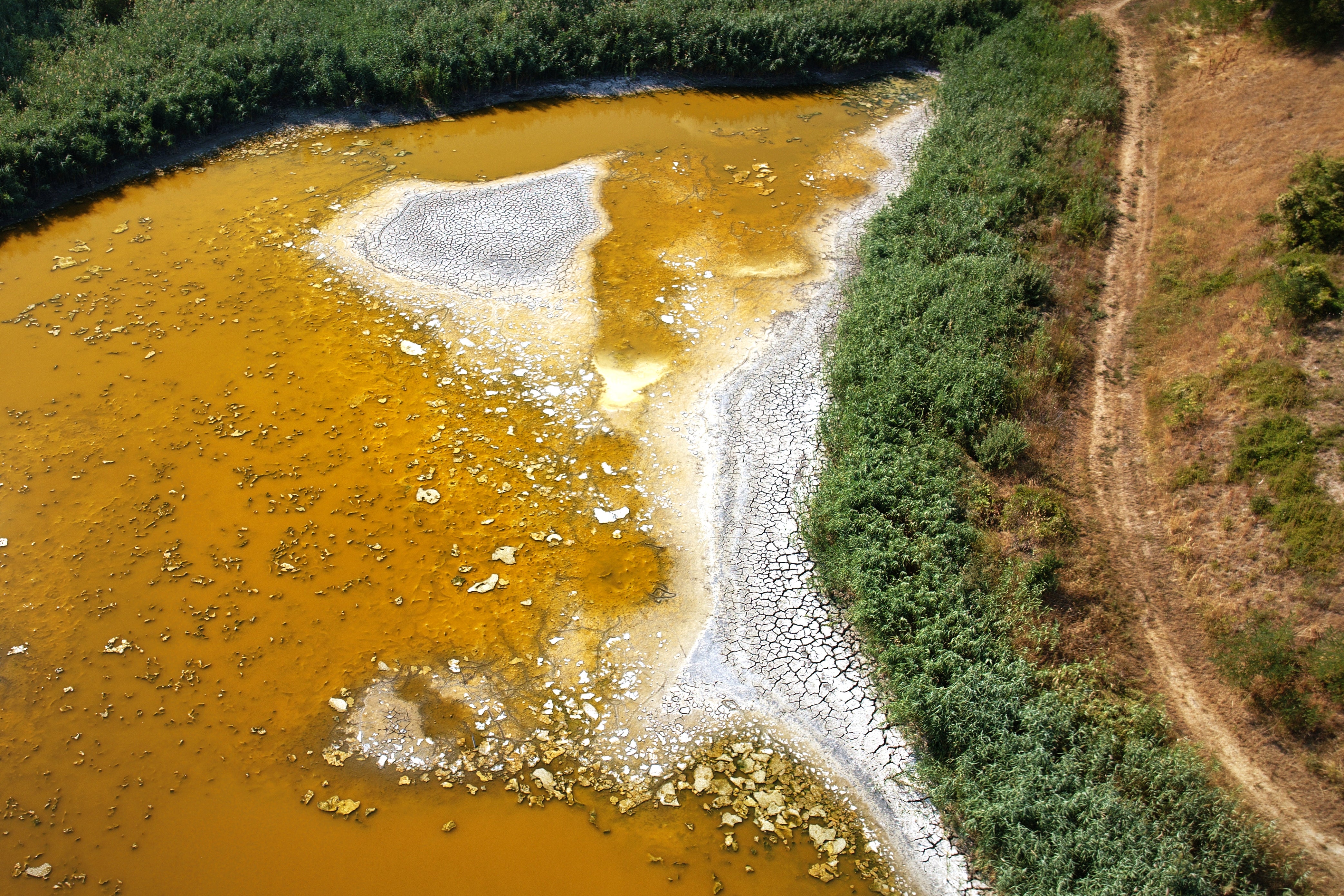 The bed of Lake Garancsi is exposed as the popular tourist destination near Budapest after the lake died out following an extended drought period near Tinnye, Hungary, on Aug. 8, 2026. (AP Photo/Bela Szandelszky)