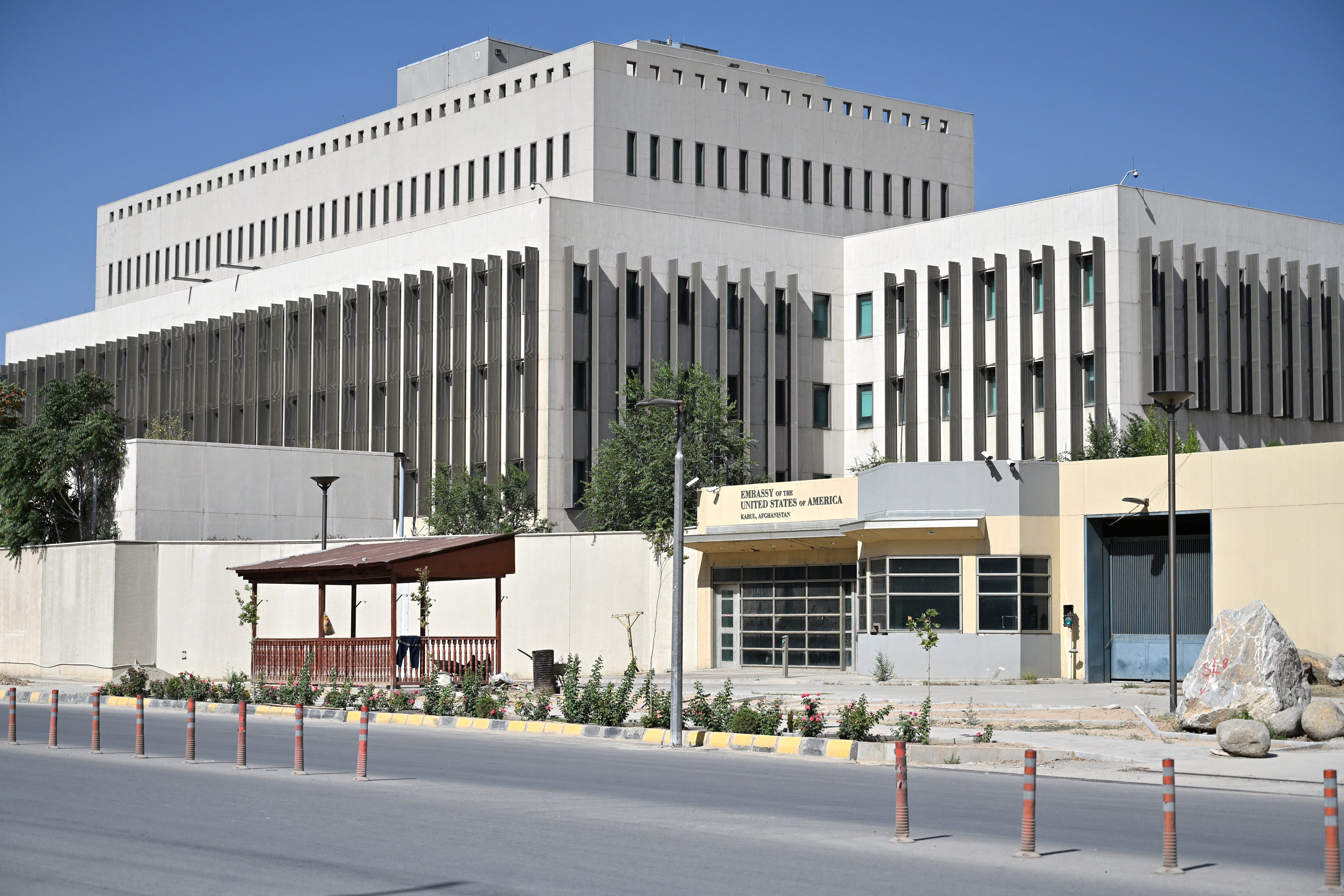 The former US Embassy building is pictured during a parade by Taliban security personnel celebrating the fifth anniversary of their return to power in Kabul