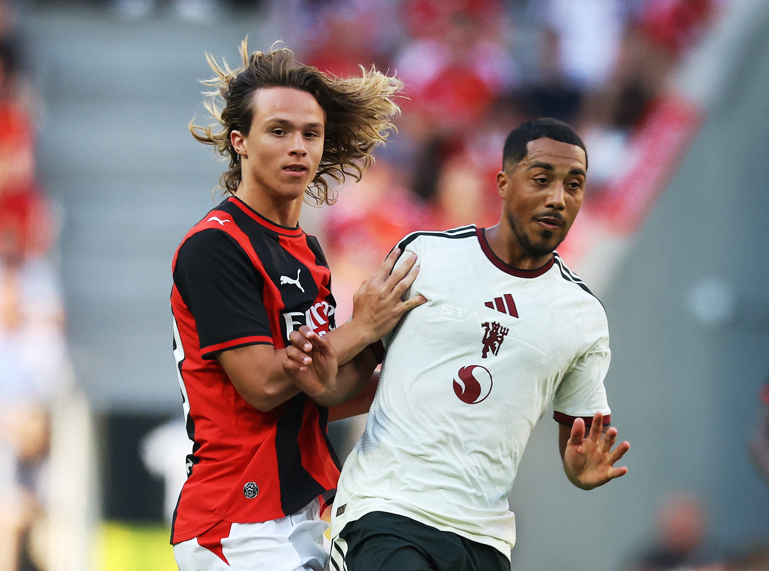 Manchester United's Youri Tielemans in action with AC Milan's Christian Comotto
