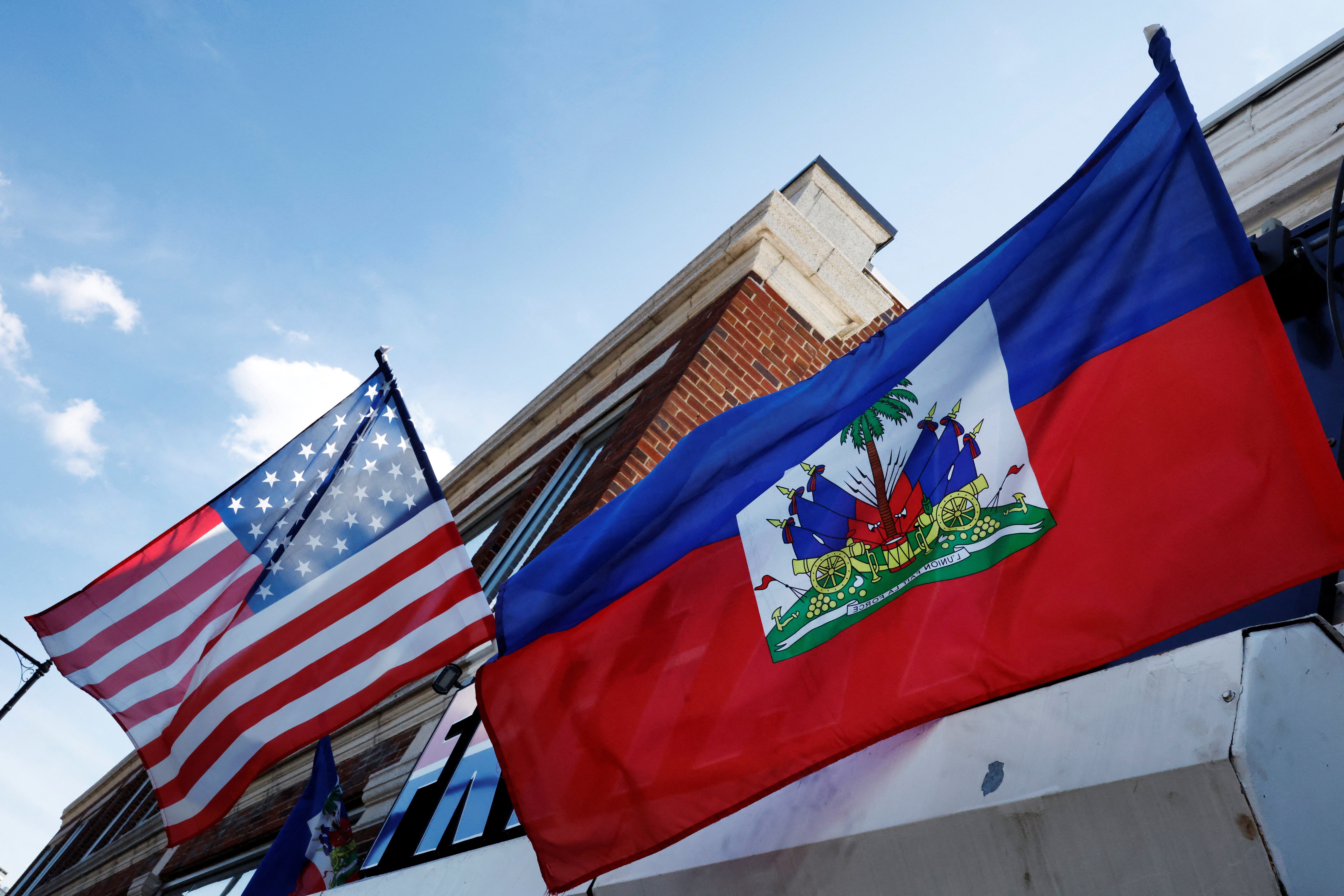 The U.S. and Haitian flags flutter in Boston, Massachusetts