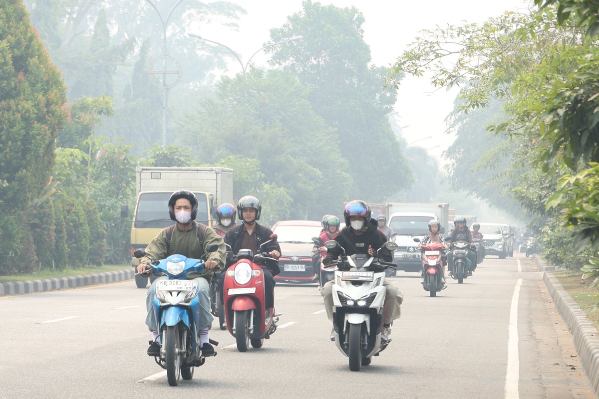 Indonesia warns against open fires as wildfire haze spreads to Malaysia