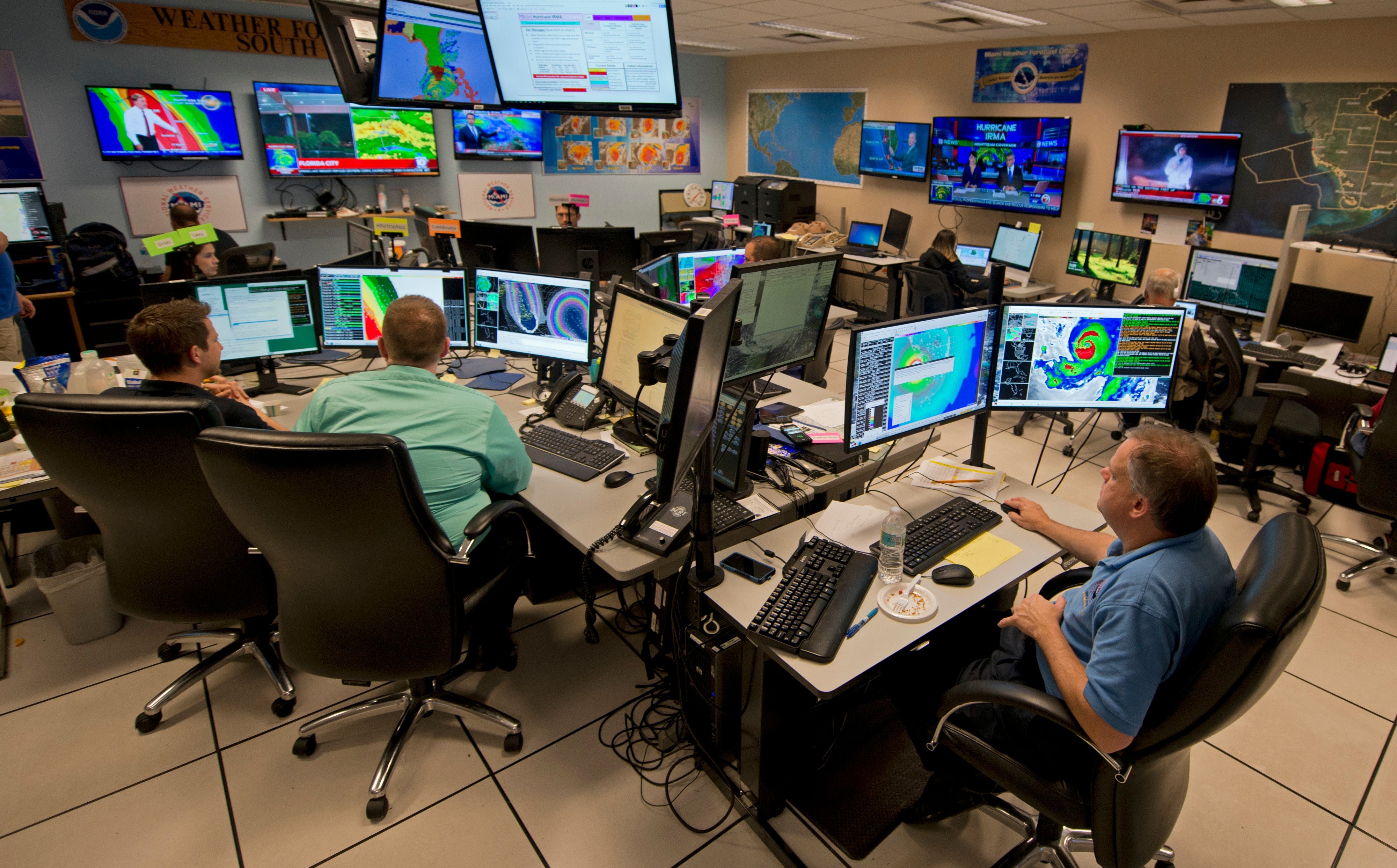 Forecasters at the National Weather Service office monitor Hurricane Irma, Sept. 9, 2017, at the hurricane center in Miami