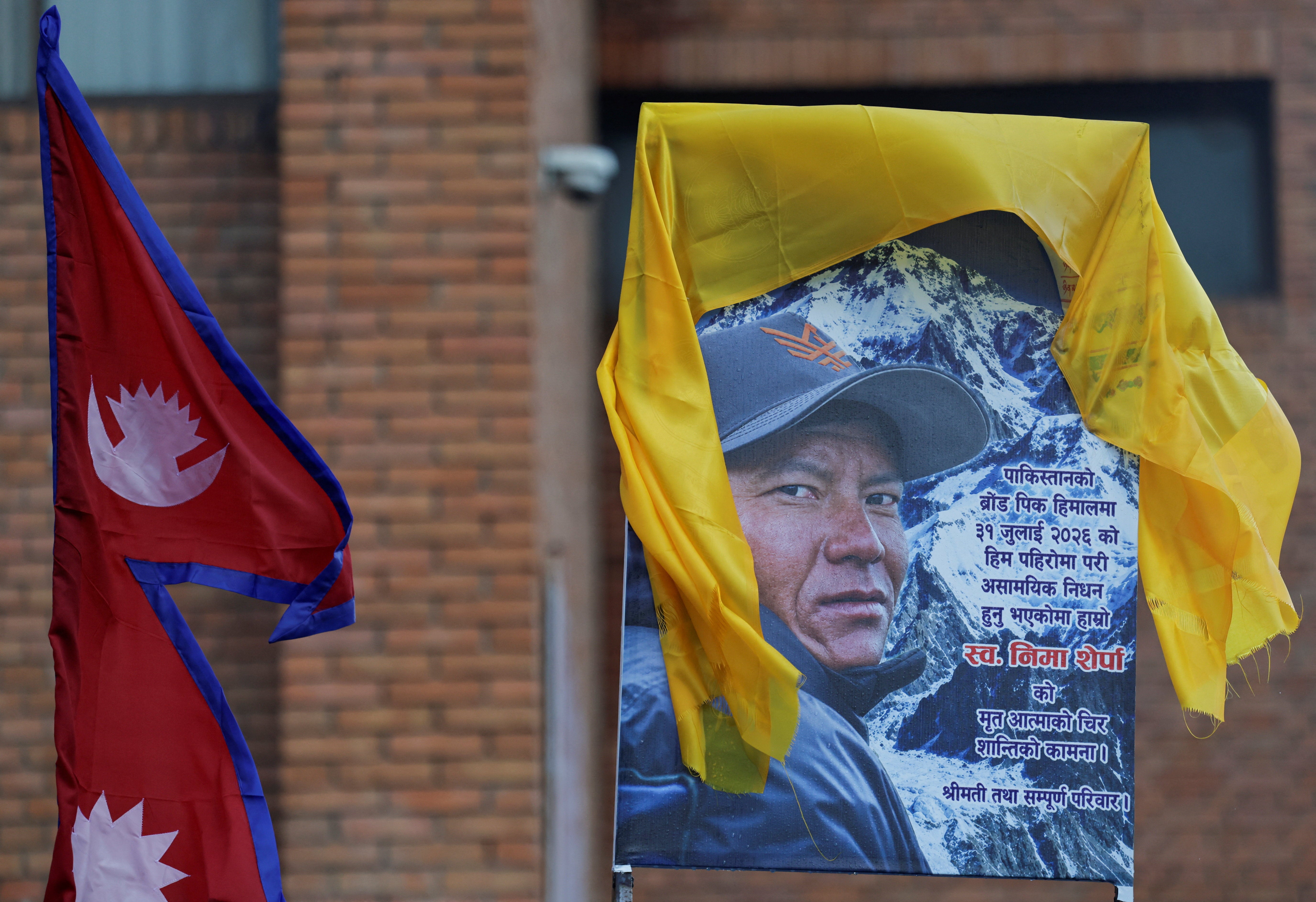 A portrait of Nima Sherpa is kept on the vehicle designated to transport his body at Tribhuvan International Airport in Kathmandu