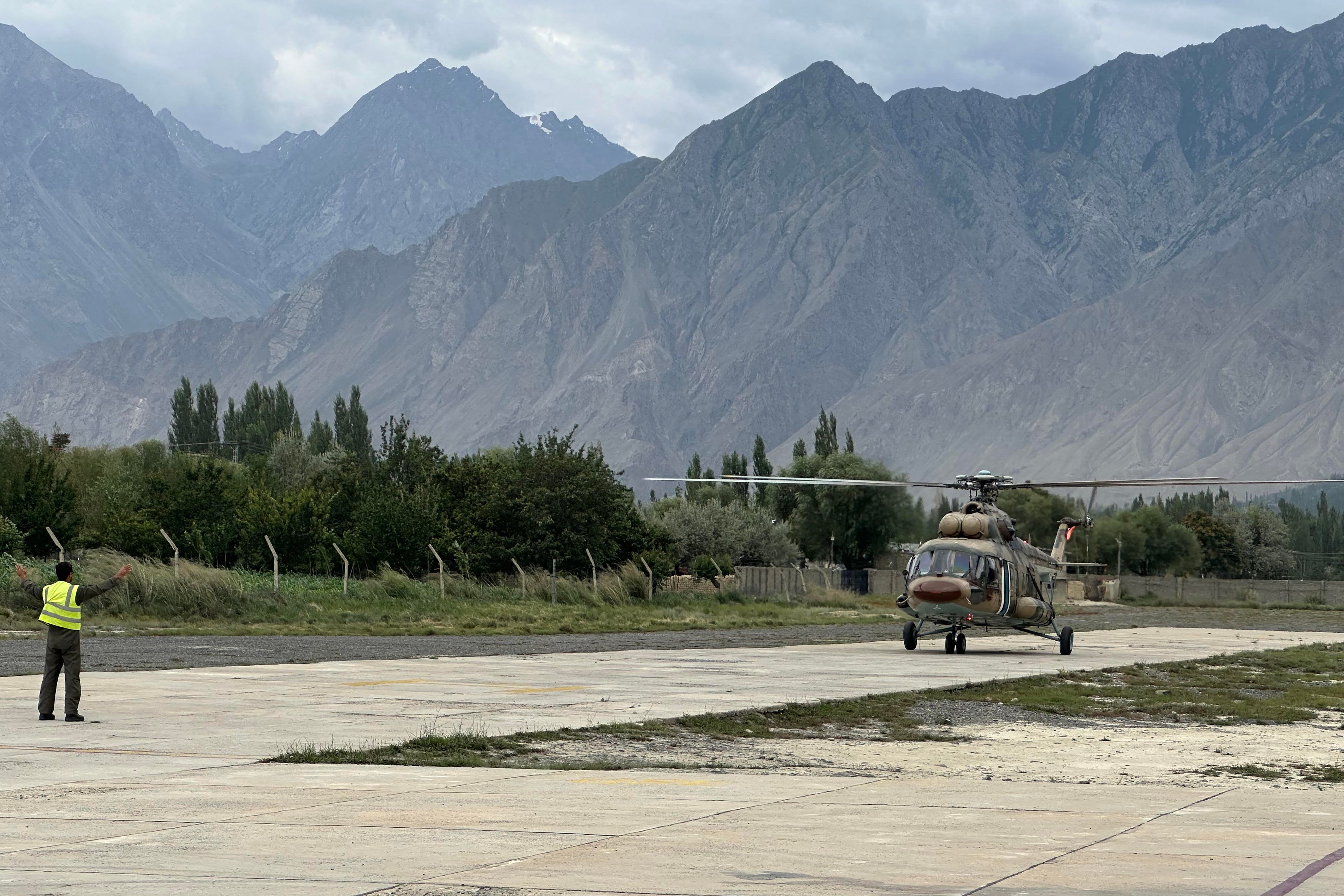 A Pakistani army helicopter carrying the bodies of the deceased climbers, lands at a military base in Skardu in Pakistan's Gilgit-Baltistan on August 6