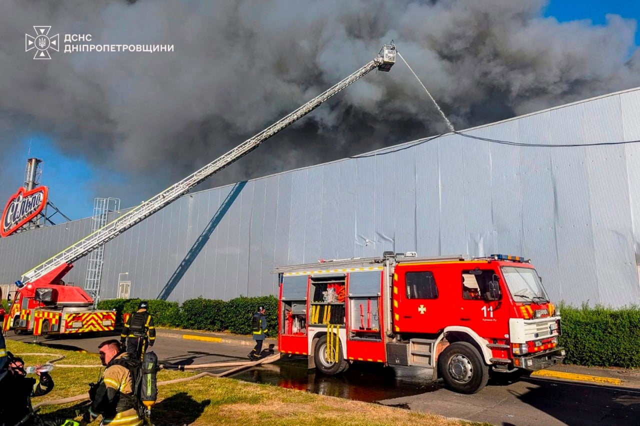 Firefighters work at a site of a shopping centre hit by a Russian drone attack in Kryvyi Rig, Dnipropetrovsk region, Ukraine