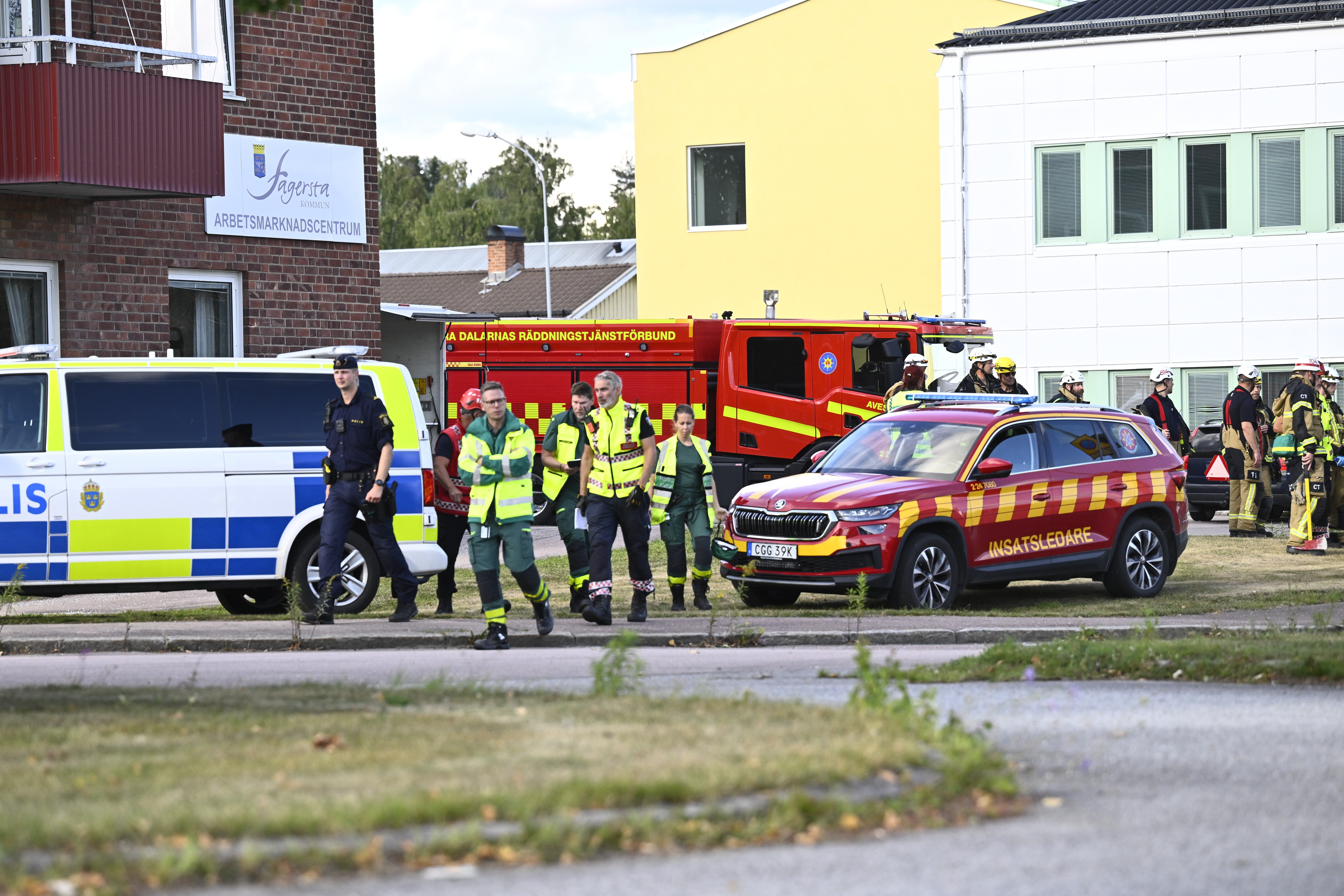 Police and emergency personnel outside Brinellskolan after the sword attack