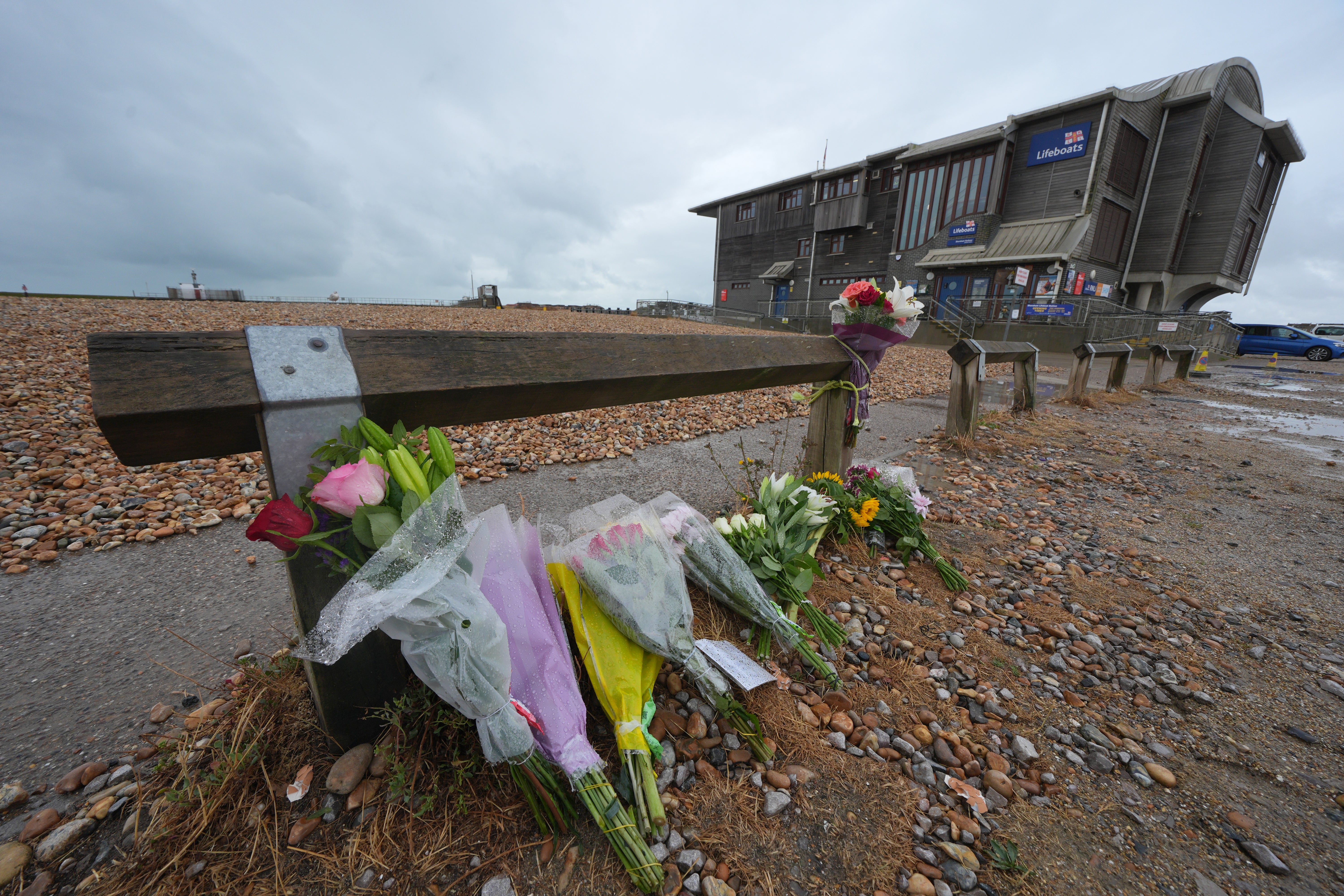 Floral tributes on the beach at Shoreham-by-Sea, West Sussex (Yui Mok/PA)