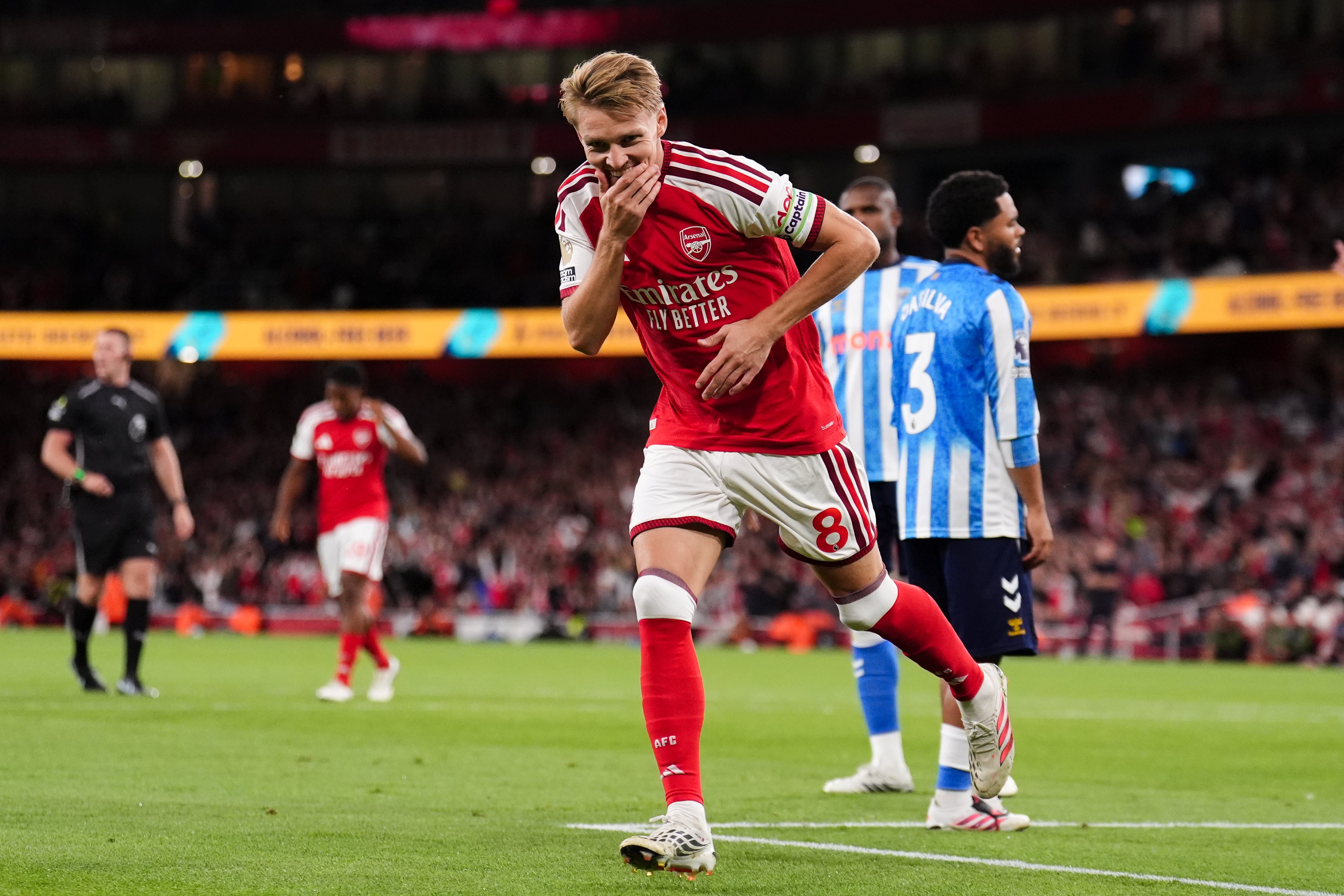 Martin Odegaard and Arsenal were all smiles as they started their title defence with a comfortable win