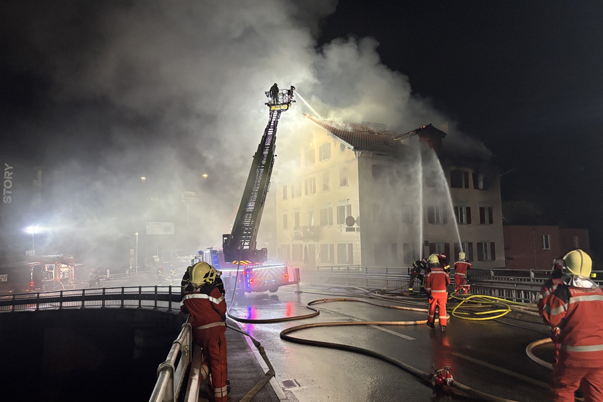 A crane was used to lift off the roof of the building and quell the blaze