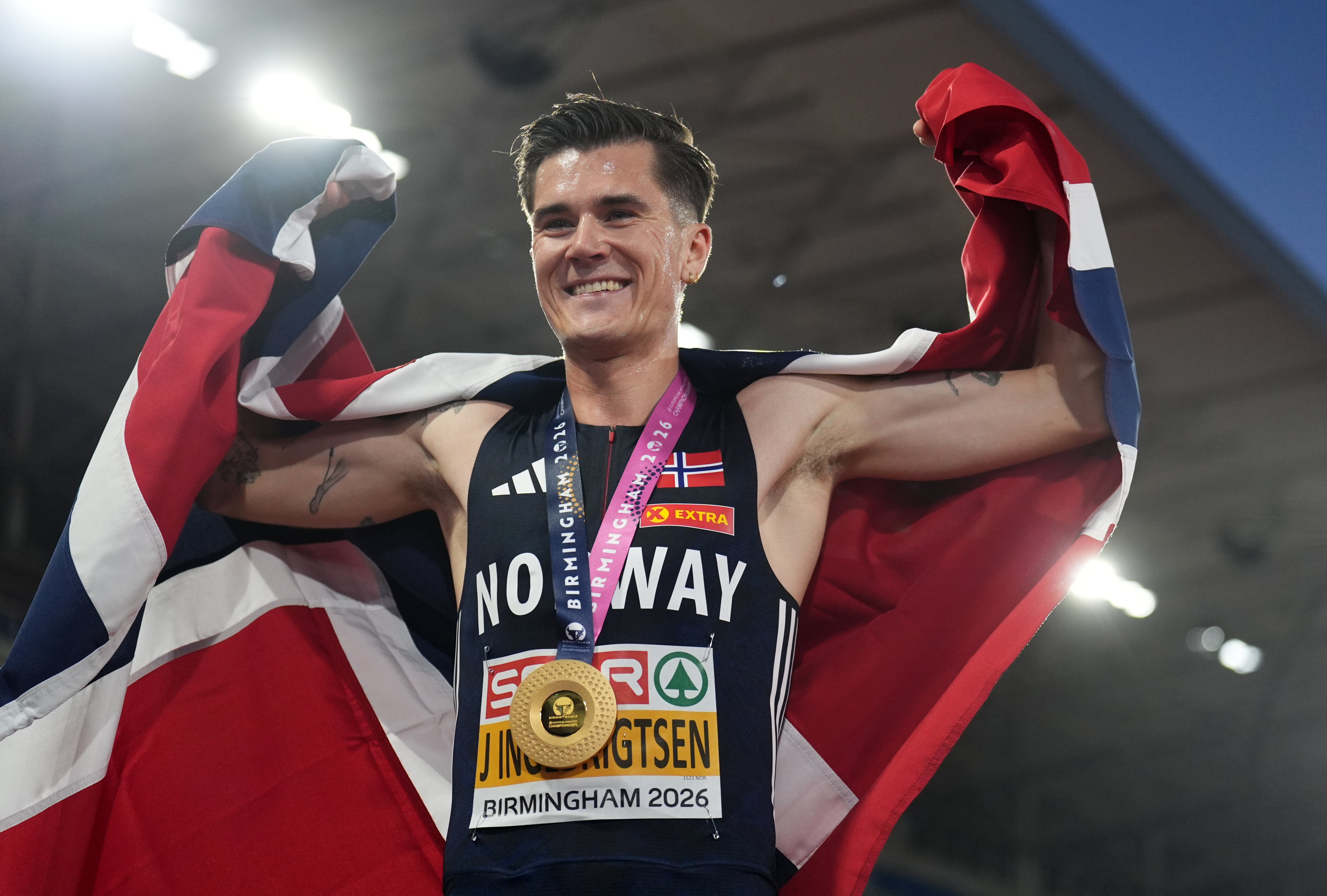 Jakob Ingebrigtsen of Norway with his medal after winning gold during the Men's 5000m Final