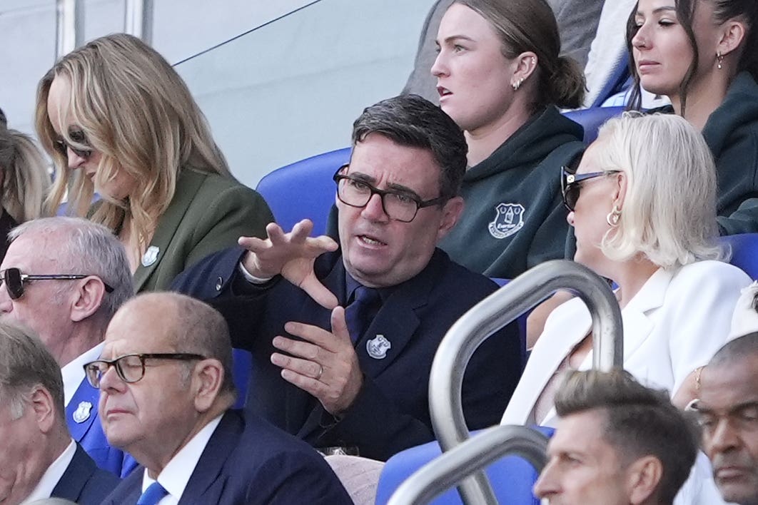 Prime Minister Andy Burnham (centre) and wife Marie-France van Heel in the stands during the Premier League match at the Hill Dickinson Stadium (Peter Byrne/PA)