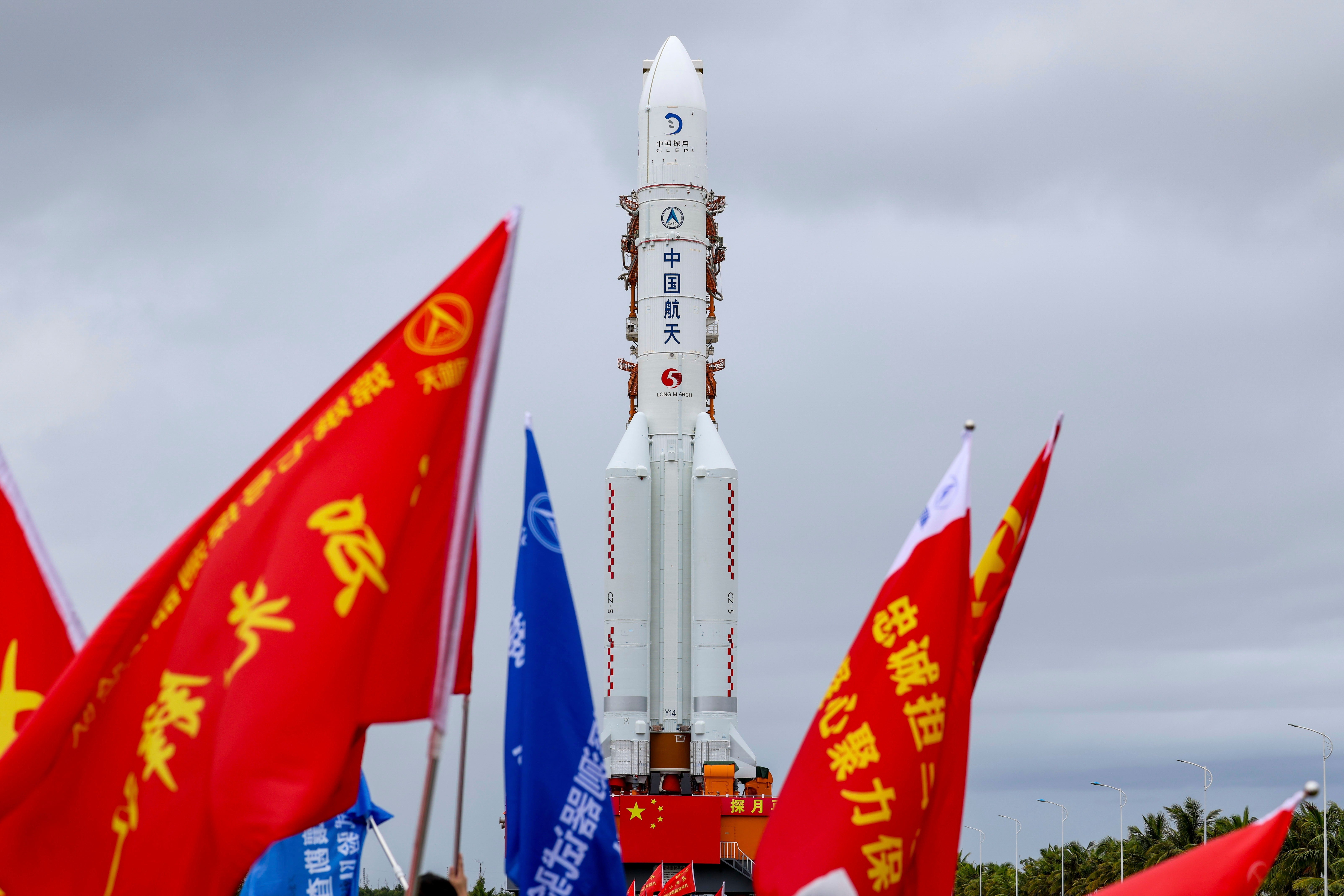 In this photo released by Xinhua News Agency, the combination of the Chang'e-7 lunar probe and the Long March-5 Y14 carrier rocket is transferred vertically to the launching area at the Wenchang Spacecraft Launch Site in southern China's Hainan Province on Wednesday, Aug. 19, 2026
