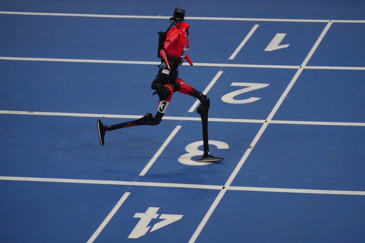 Humanoid robots sprint, play soccer and set records at Beijing games, in photos