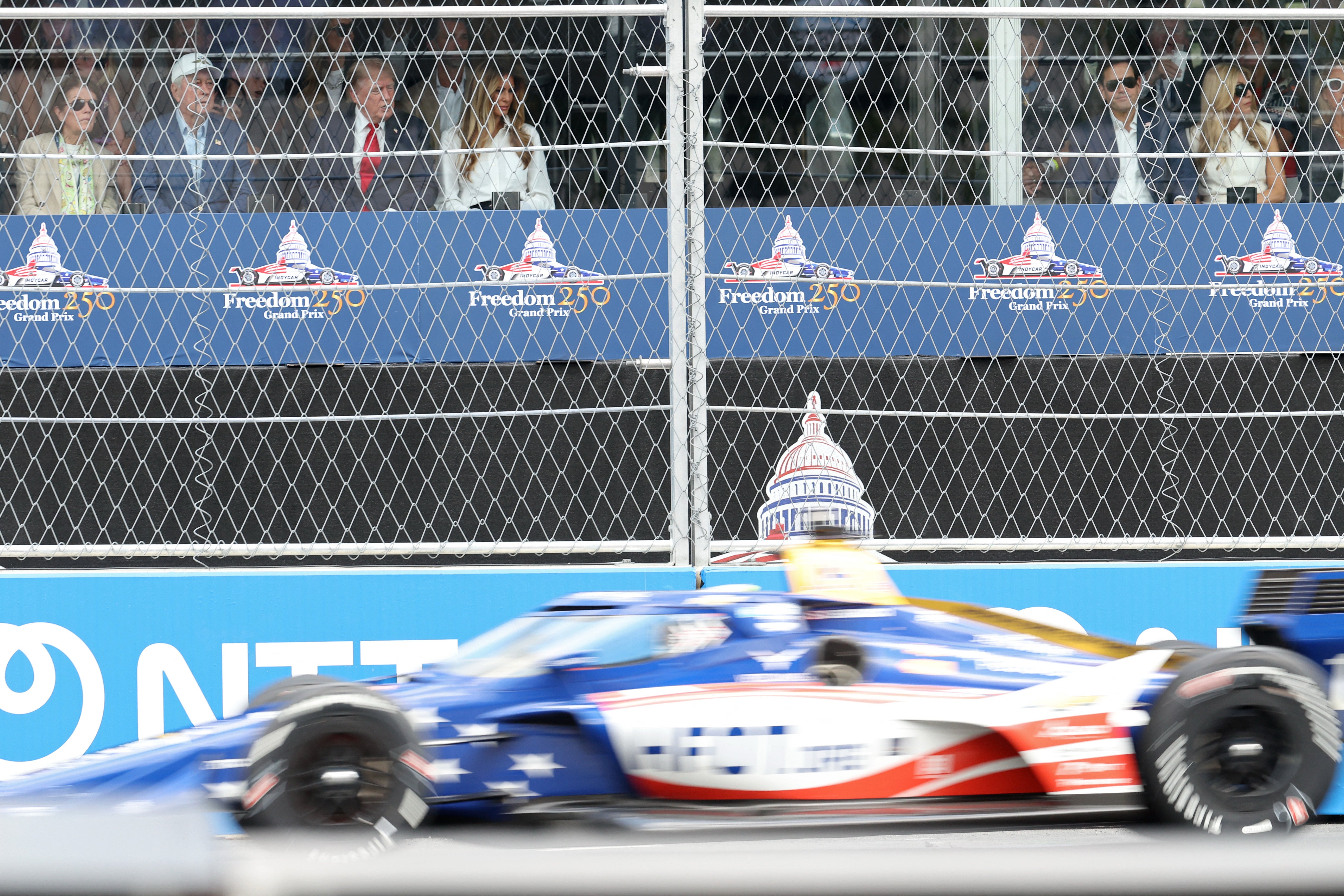 UFC president Dana White sits with IndyCar and Indianapolis Motor Speedway owner Roger Penske, President Donald Trump, and First Lady Melania Trump in a suite during the Freedom 250 Grand Prix