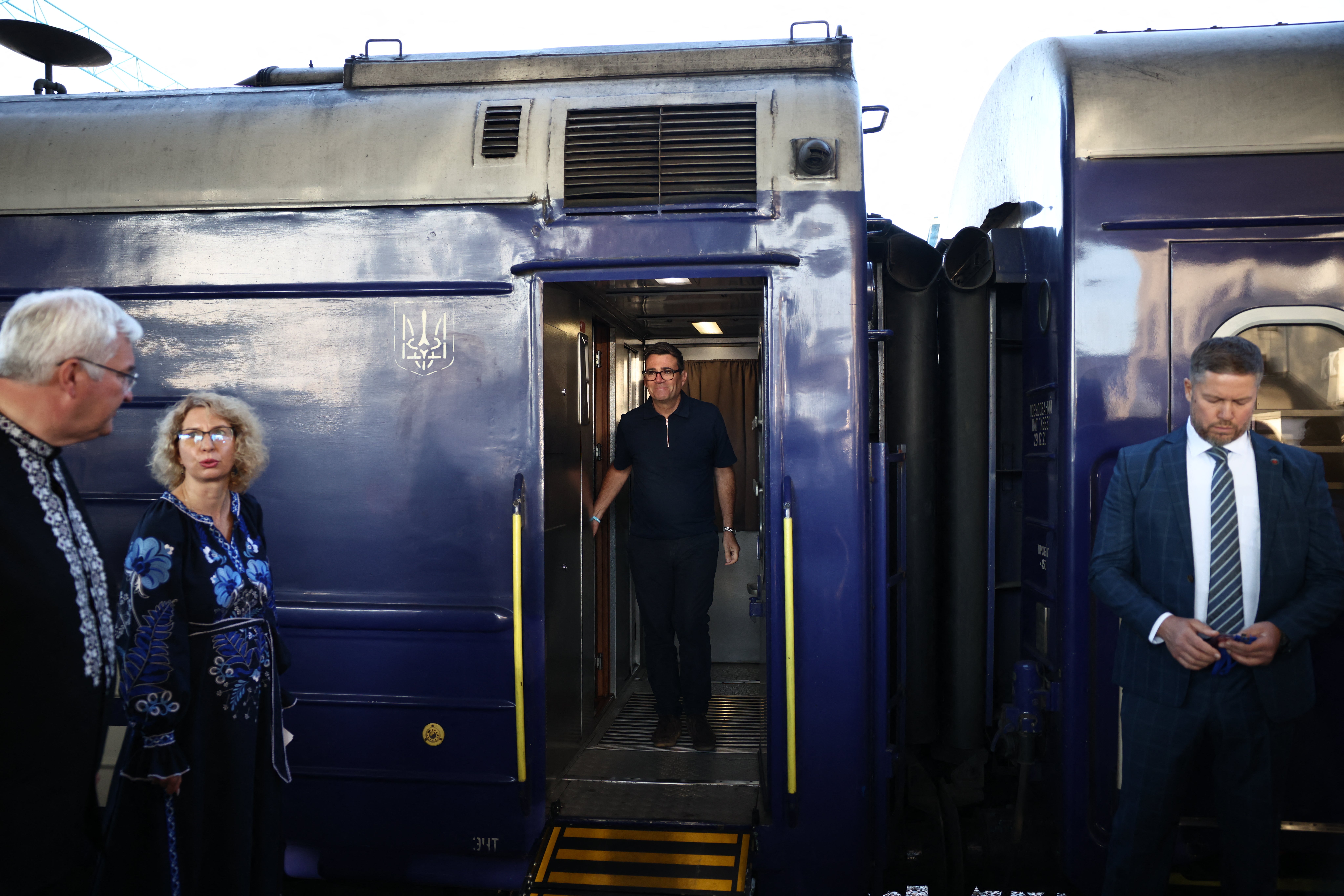 Ukraine's foreign affairs minister Andrii Sybiha prepares to greet prime minister Andy Burnham upon his arrival by train in Kyiv