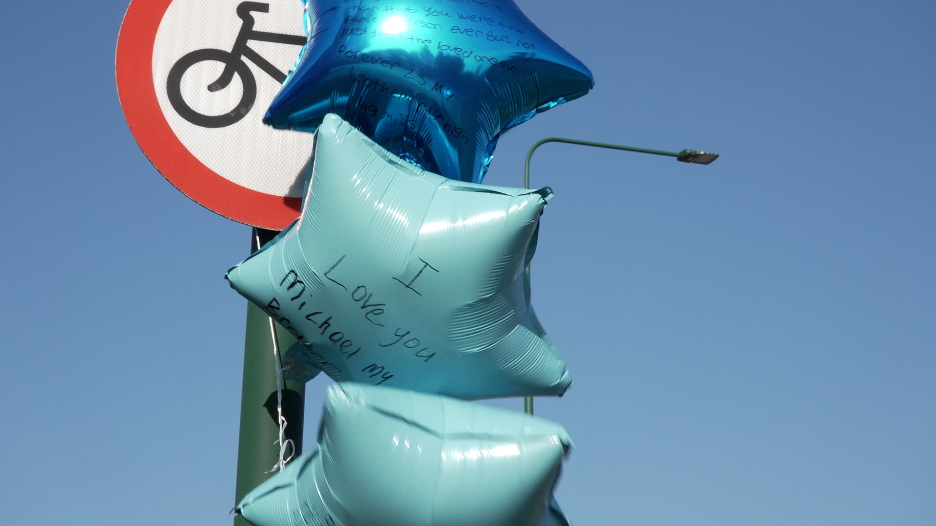 Balloons with messages left near to the scene on the A66 in South Bank (PA)
