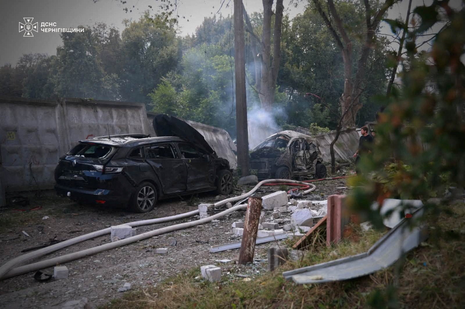 Damaged cars at the site of an apartment building hit by a Russian drone strike, amid Russia's attack on Ukraine, in Chernihiv