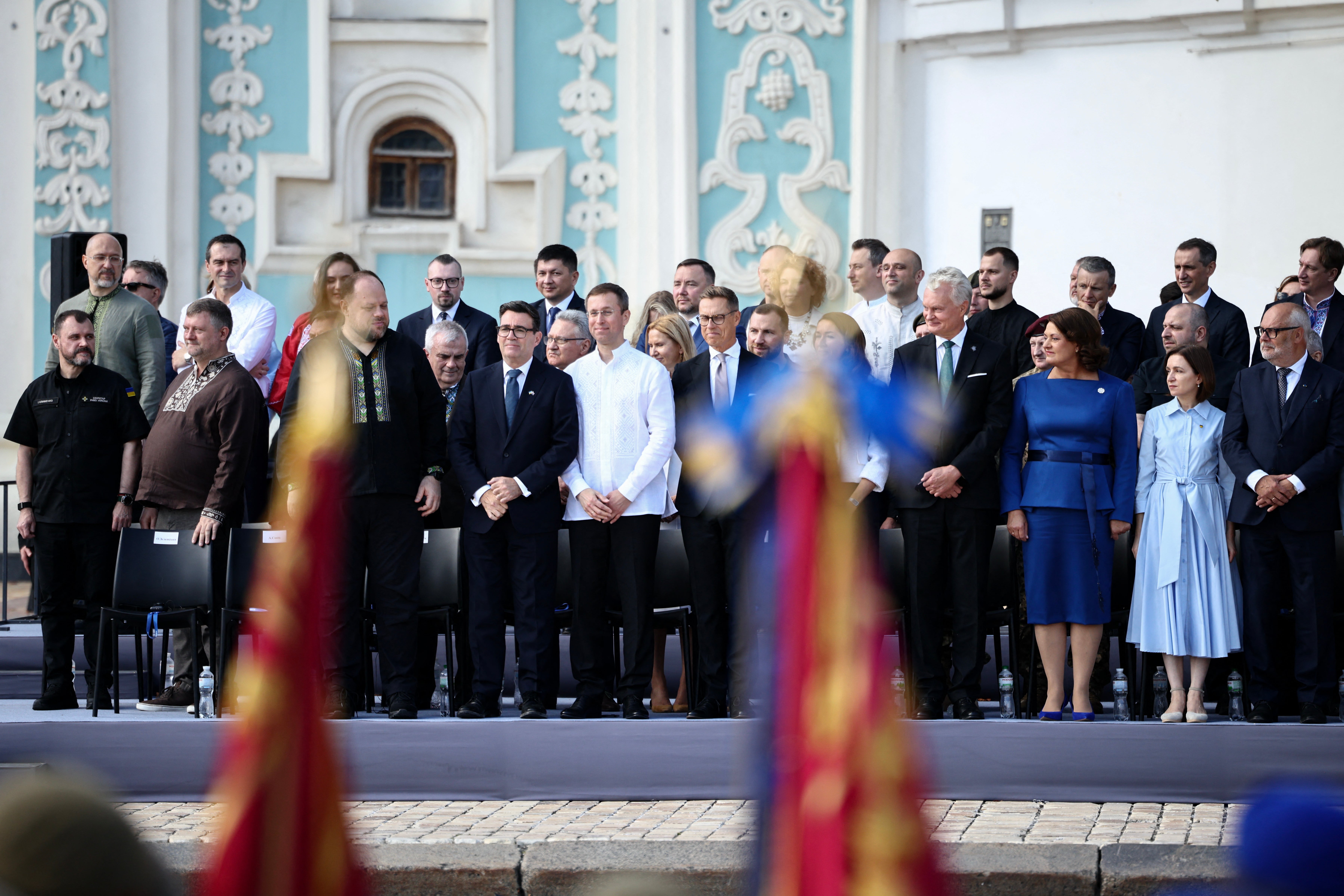 From L) Ukraine's Defense Minister Denys Shmyhal (TopL), Britain's Prime Minister Andy Burnham (4thL), Finland's President Alexander Stubb (C), Lithuania's President Gitanas Nauseda (4thR), Ukraine's Defence Minister Rustem Umerov (4thR Rear) and Estonia's President Alar Karis (R) attend the commemorative ceremony
