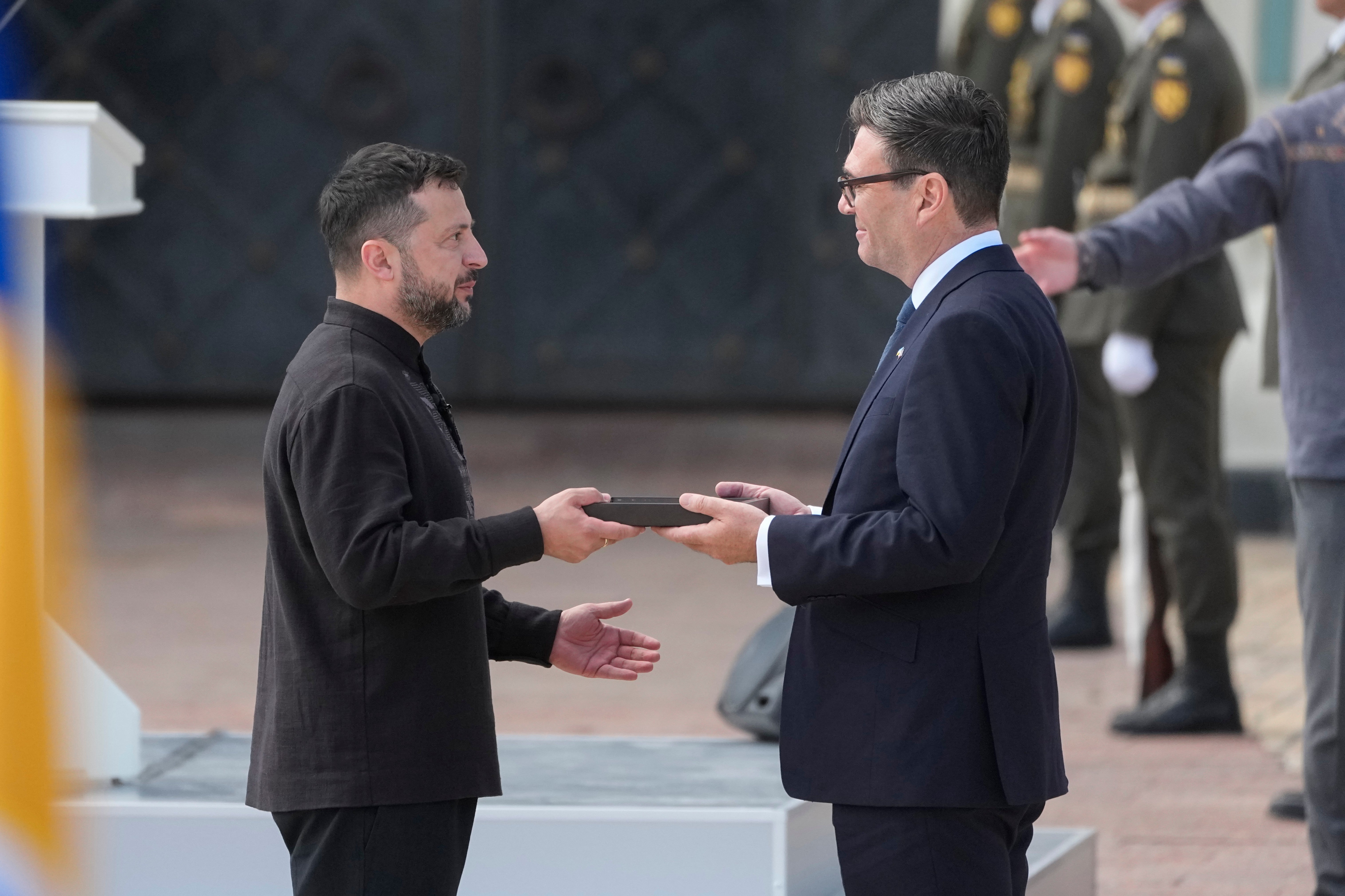 Ukrainian President Volodymyr Zelenskyy, left, and Britain's Prime Minister Andy Burnham attend a commemorative ceremony marking Ukraine's 35th Independence Day, in Kyiv, Ukraine, Monday, Aug. 24, 2026