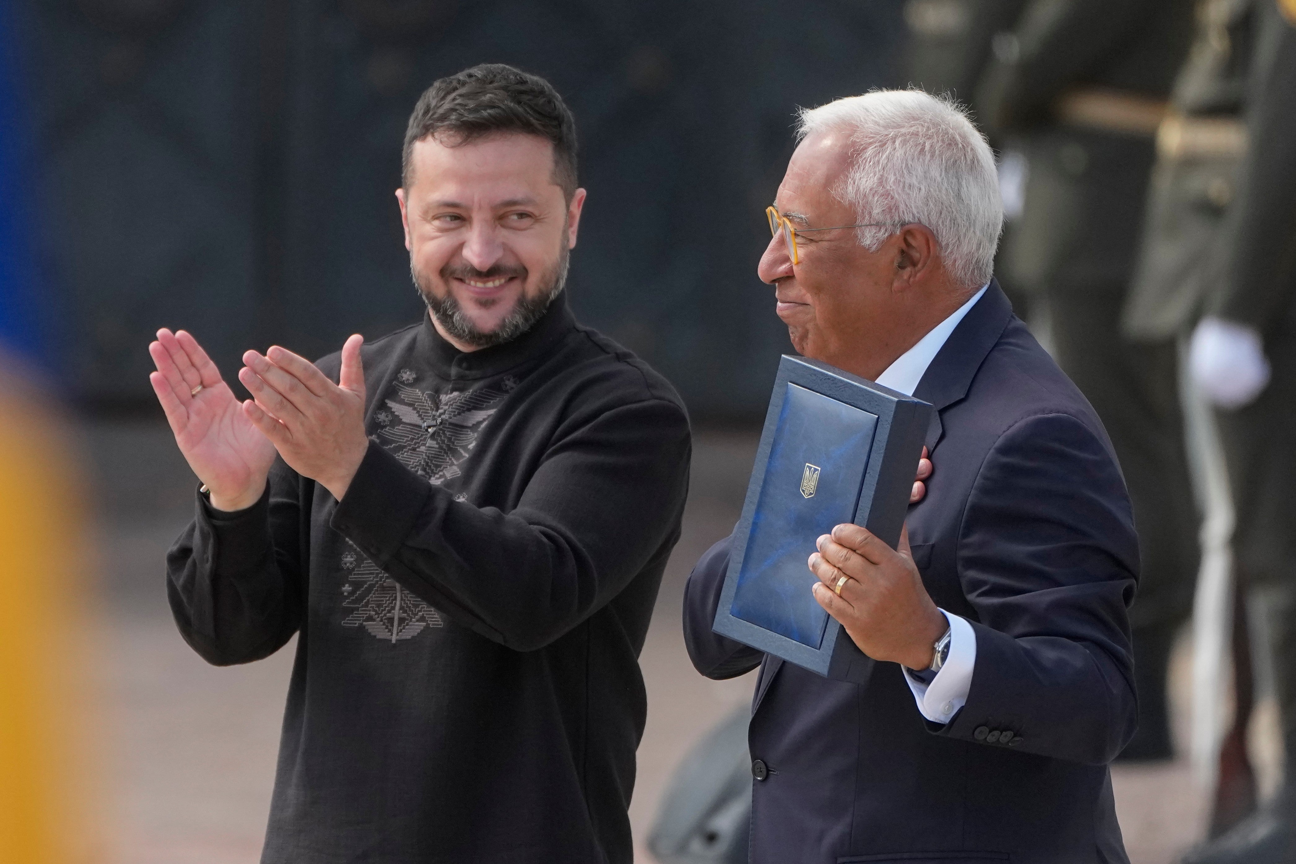 Ukraine's President Volodymyr Zelenskyy, left, hands over the Ukraine state award to European Council President Antonio Costa during a commemorative ceremony in Kyiv, Ukraine, Monday, Aug. 24, 2026, marking Ukraine's 35th Independence Day