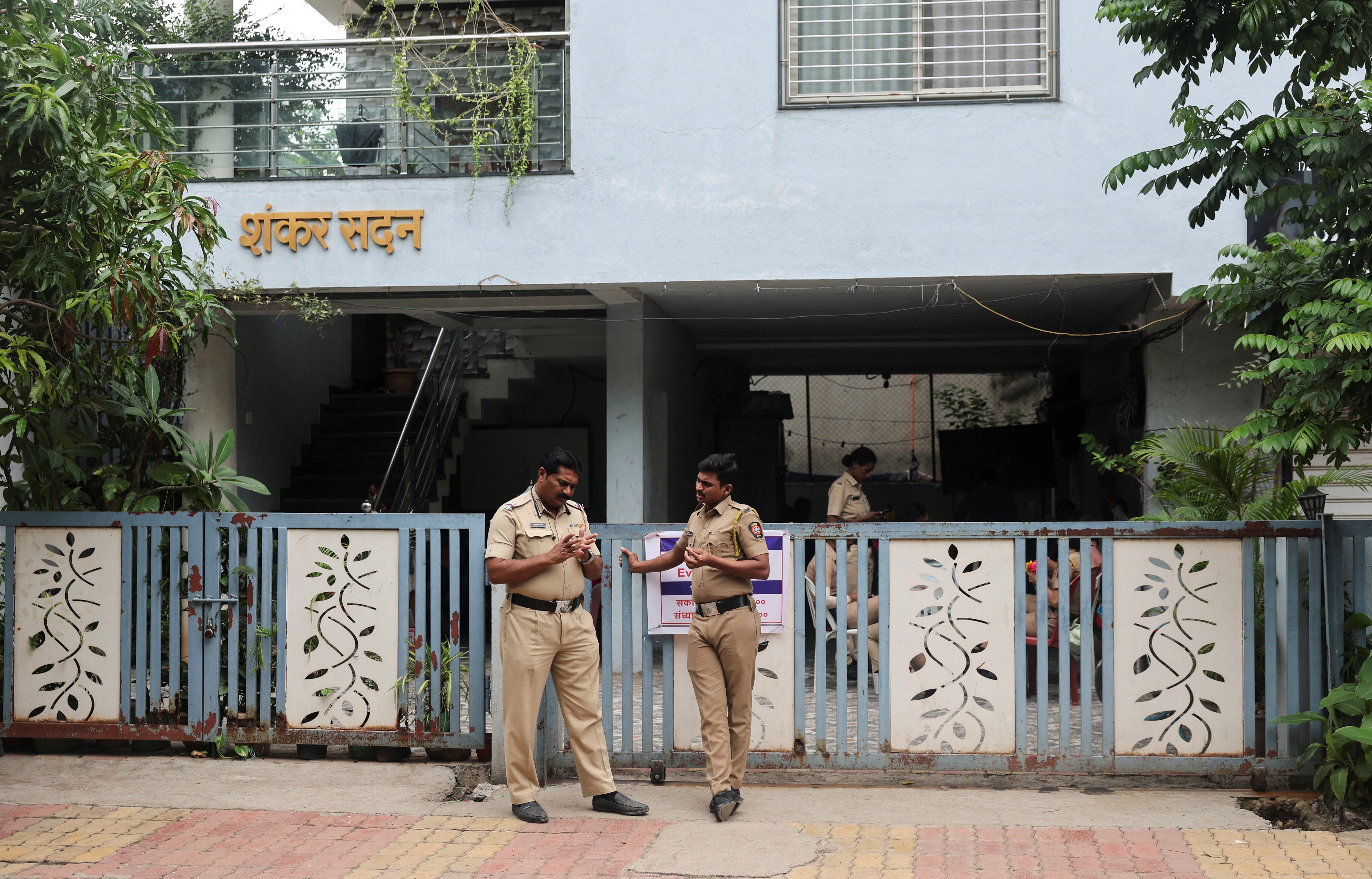 Police stand guard outside the home of Abhijeet Dipke, head of the Cockroach Janta Party (CJP) in Chhatrapati Sambhajinagar, India, August 4, 2026. REUTERS/Francis Mascarenhas