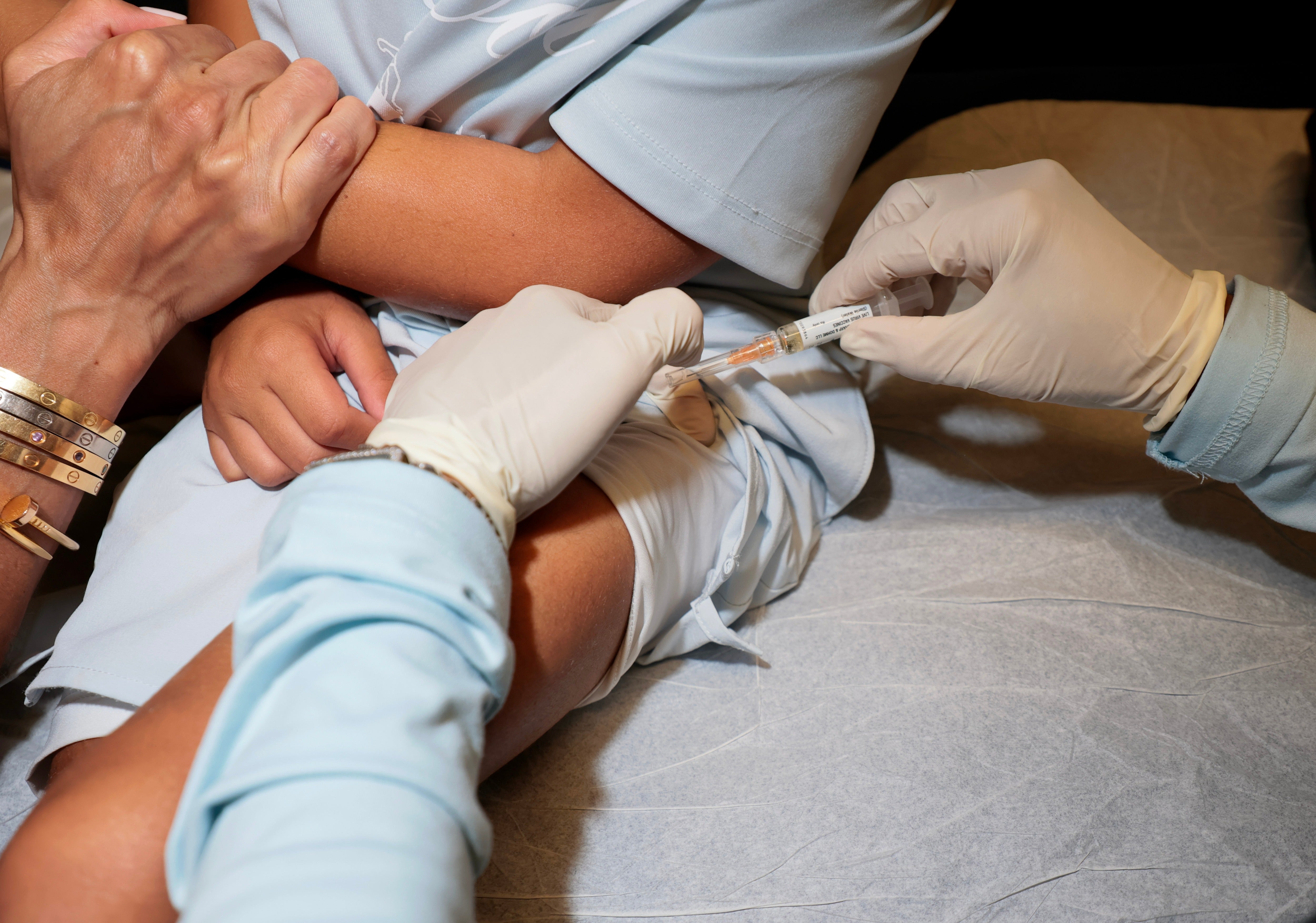 A medical assistant gives an MMR vaccine to a young person this month in Coral Gables, Florida. Measles has seen a historic resurgence in the U.S.