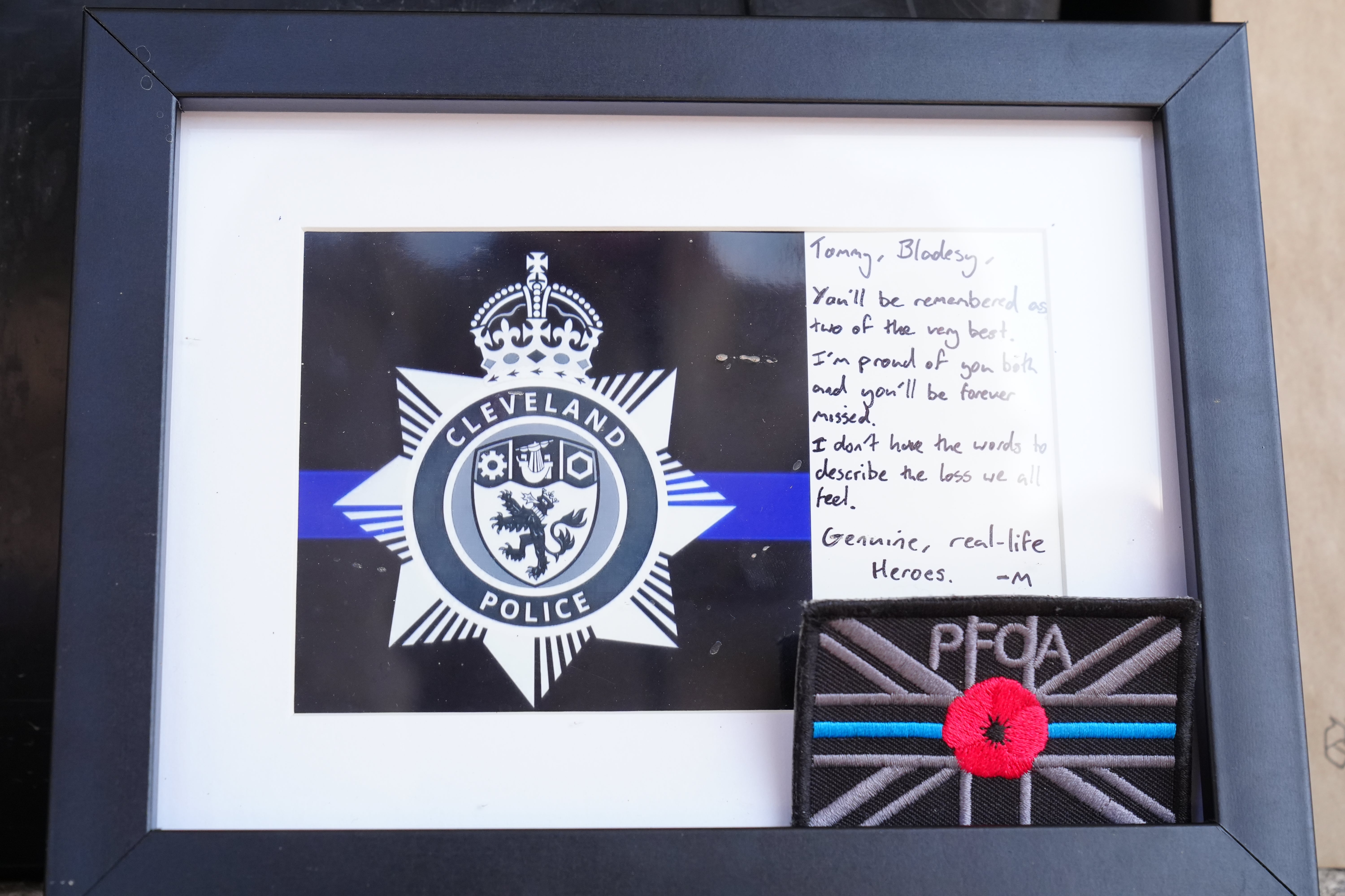 Tributes left outside the Cleveland Police HQ in Middlesbrough