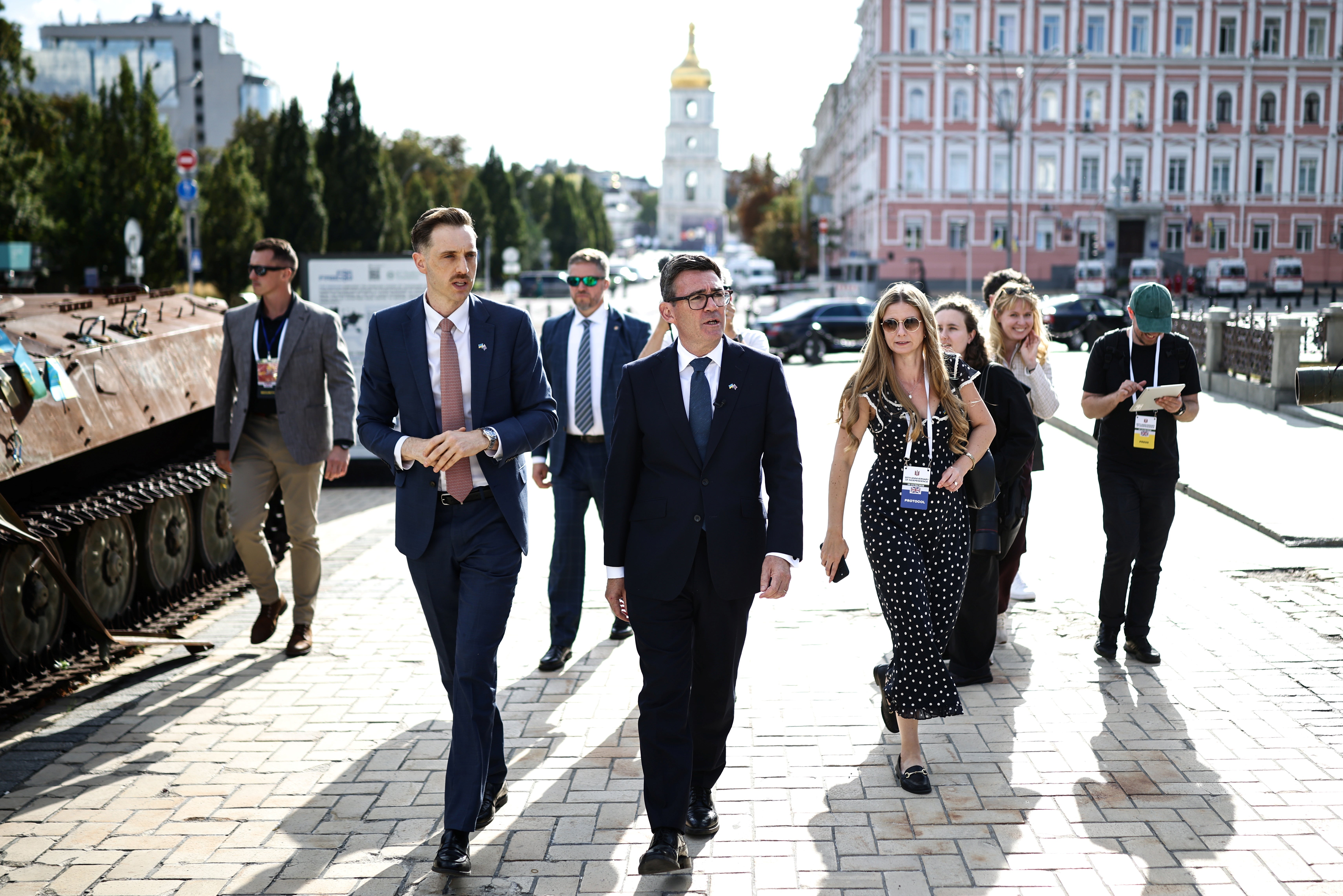 Prime Minister Andy Burnham (C) walks past destroyed Russian vehicles displayed at Mykhailivska Square