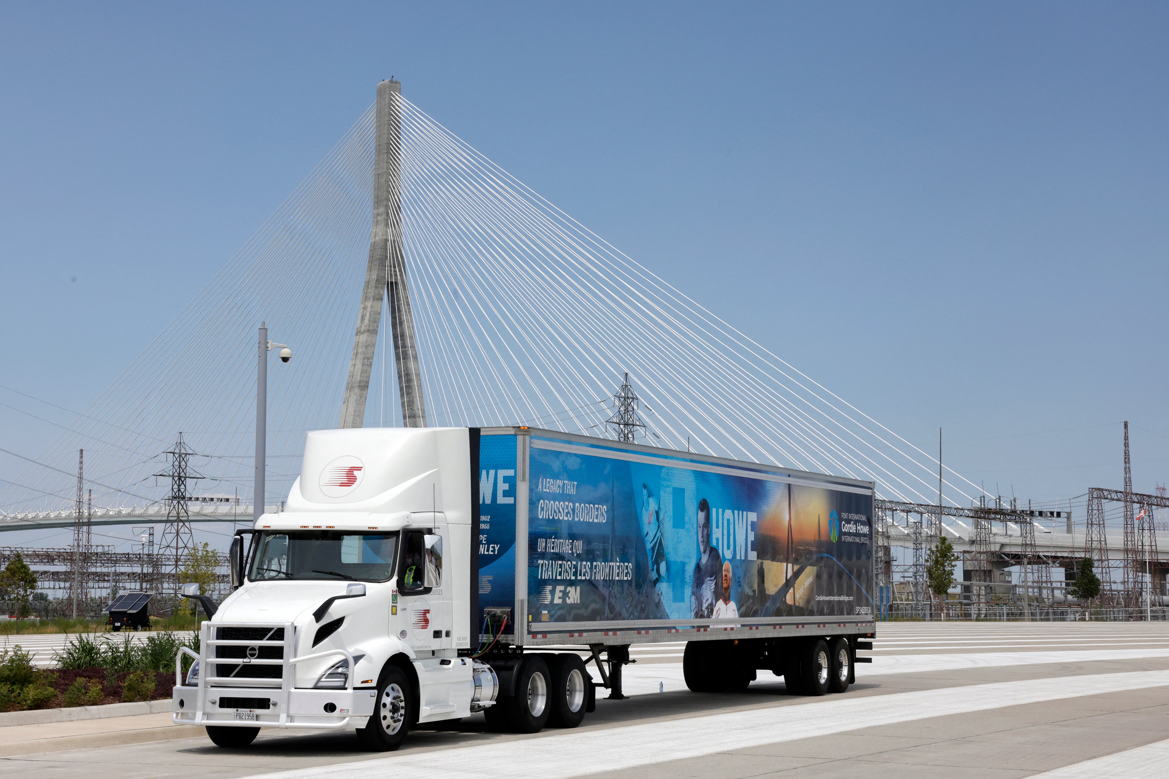  a truck drives on the Gordie Howe International Bridge during the opening ceremony in Windsor, Ontario, on July 24, 2026. The bridge connects Michigan with Ontario