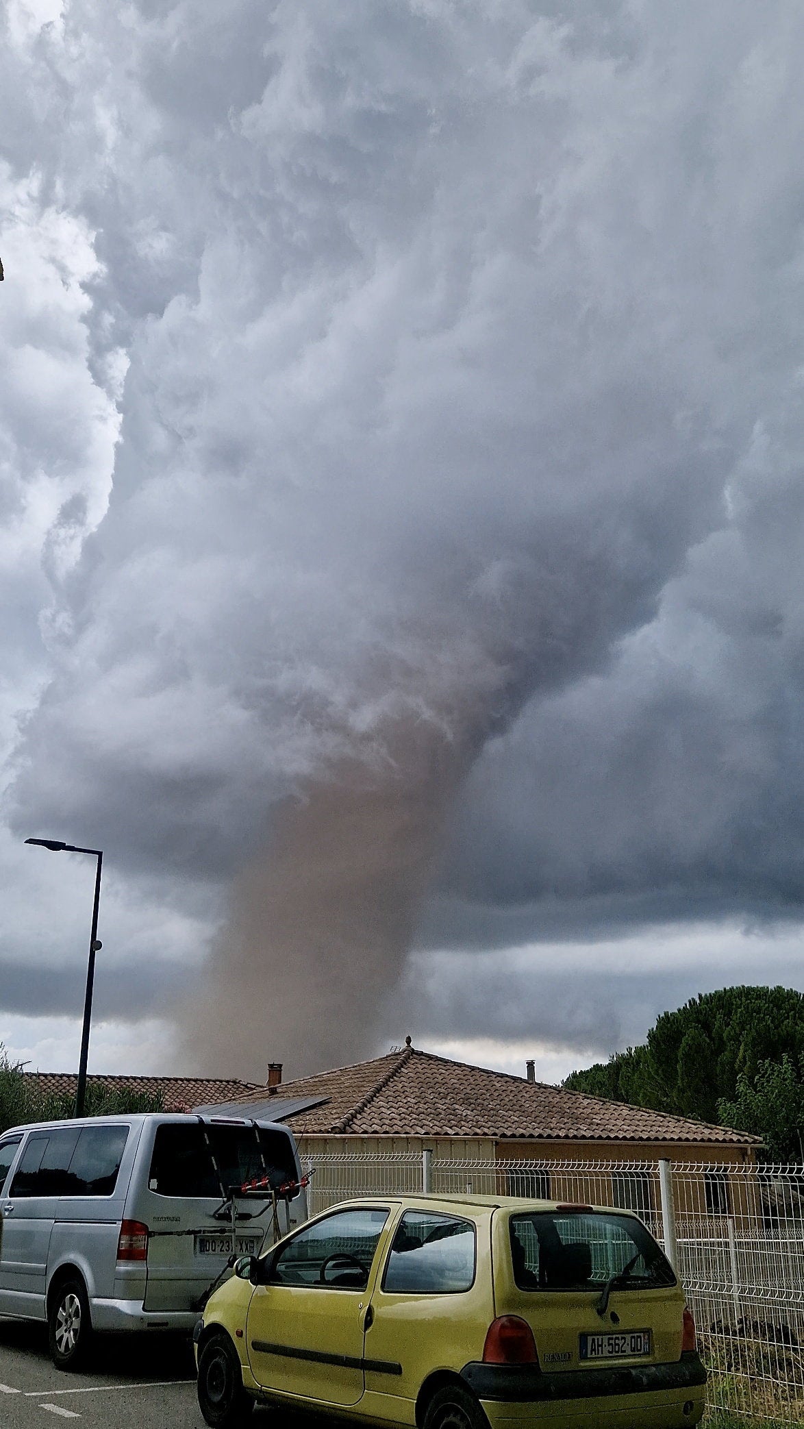 A large tornado moves through Verzeille, France, August 24, 2026, in this screen grab obtained from a social media video