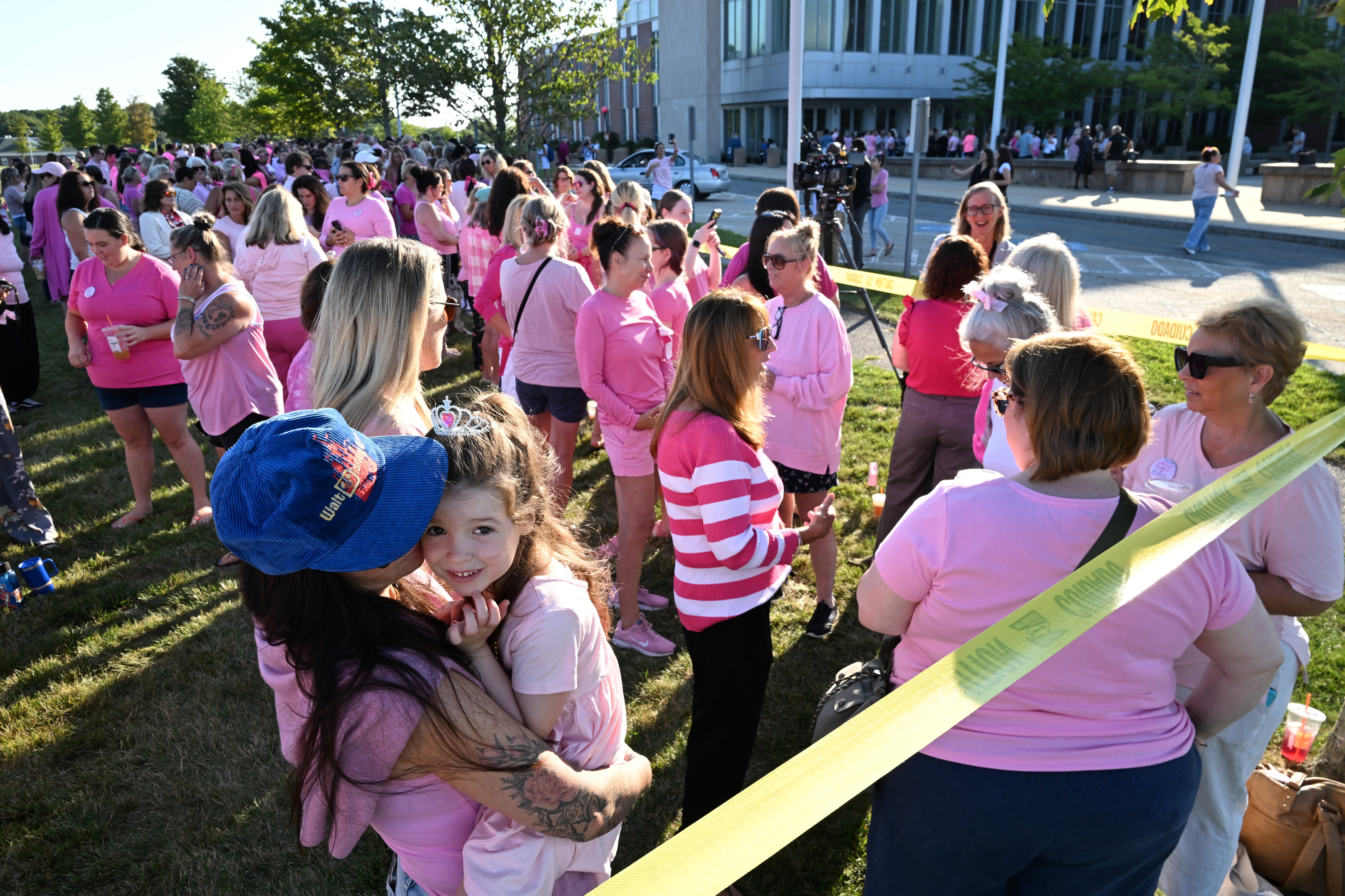 Kara Hurston holds her daughter Prinn, 4, as they join a demonstration in support of Lindsay Clancy outside Plymouth Superior Court
