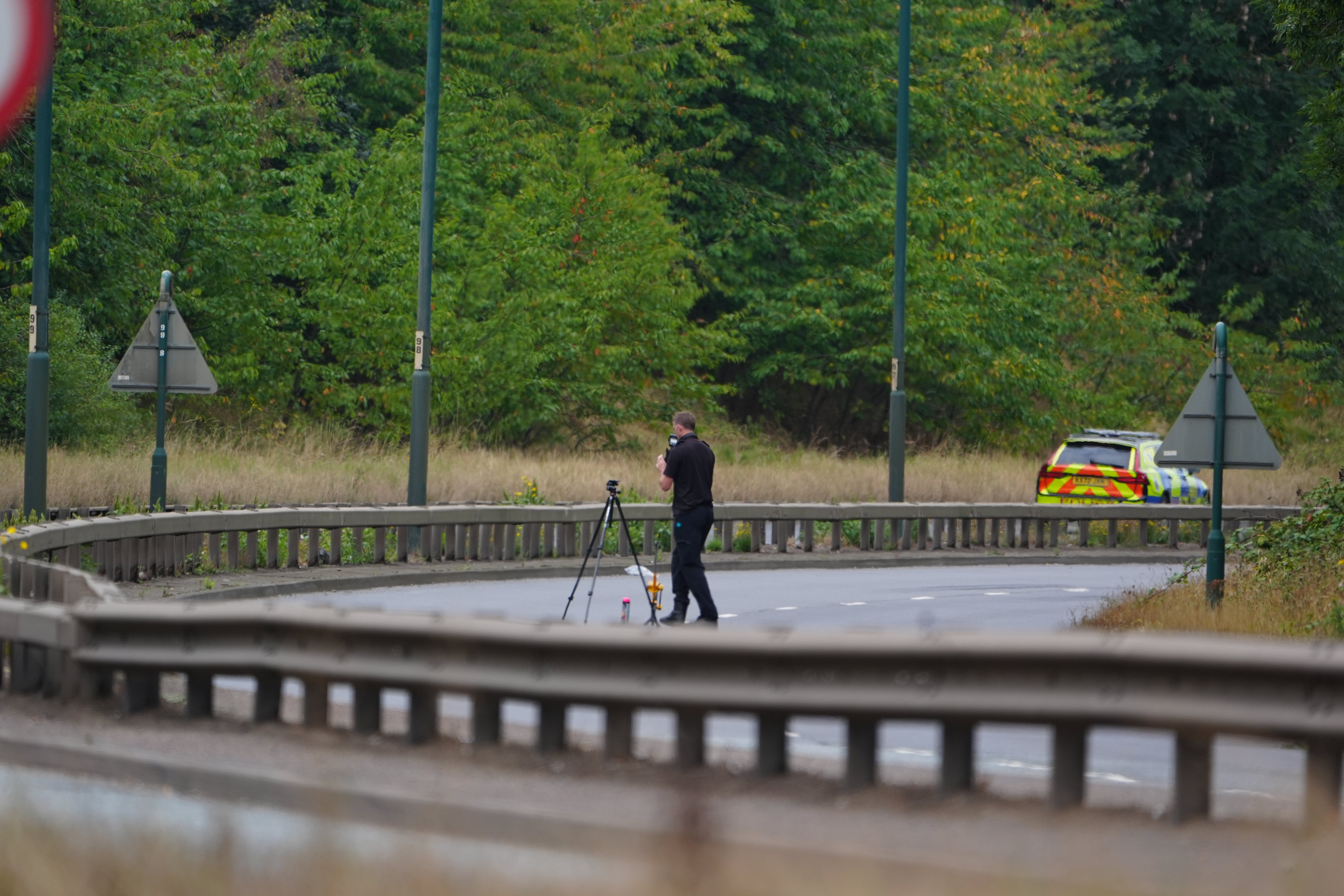 A police officer at the scene of a fatal crash involving a police car and a Volkswagen Passat on the A66 in South Bank, near Middlesbrough