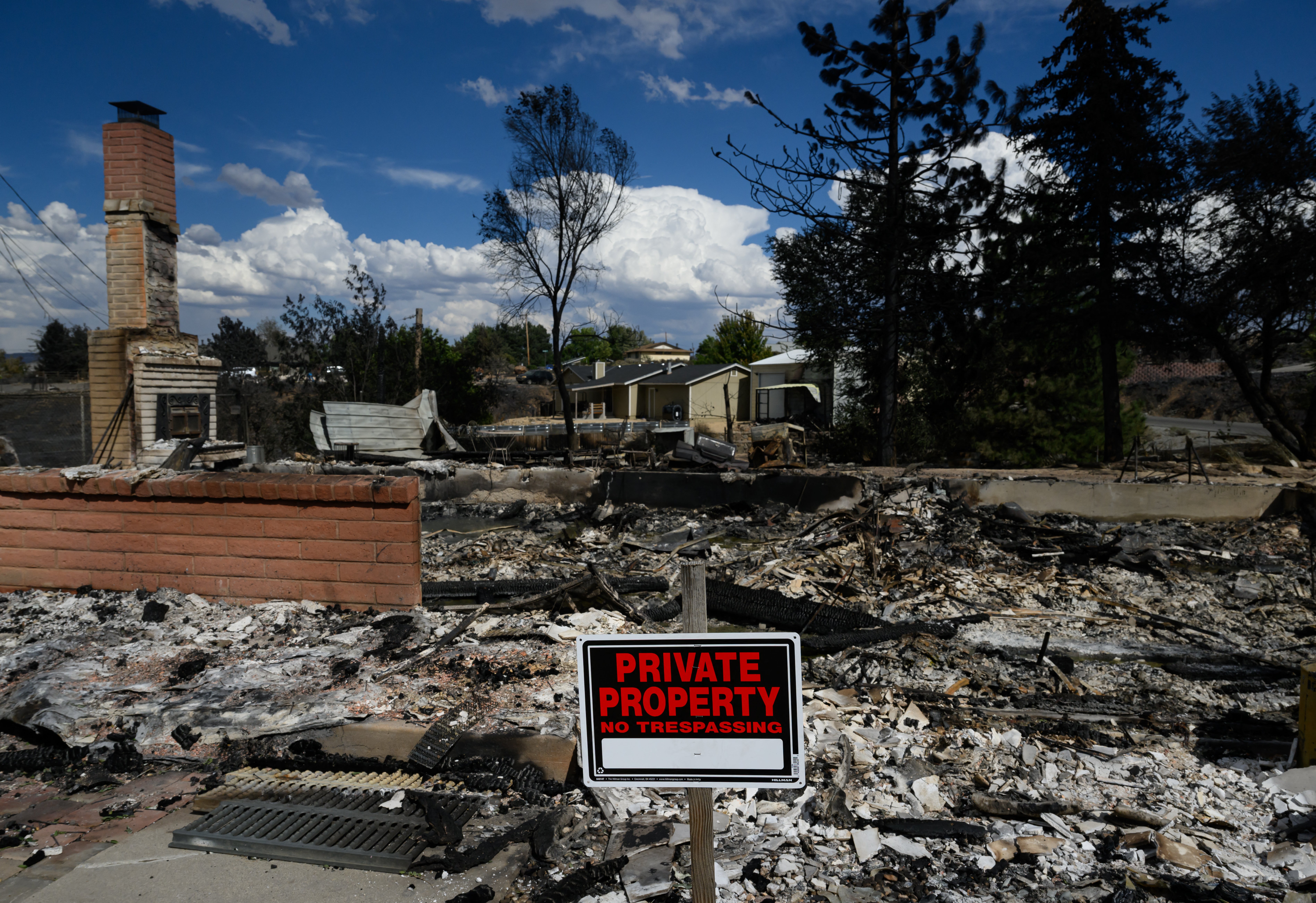 A burned home smolders after it was destroyed by the Hawk fire (AFP/Getty)