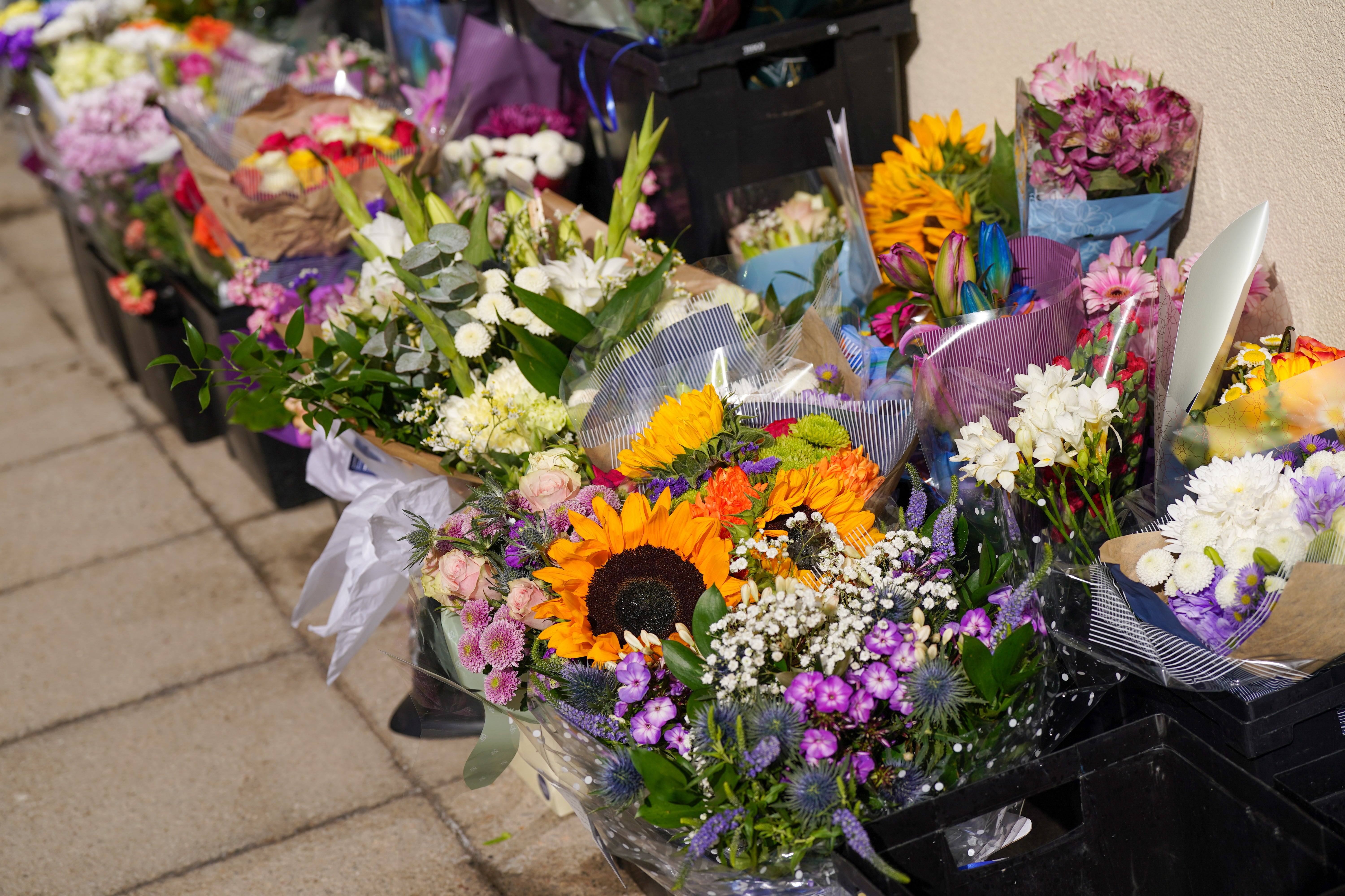 Tributes left outside Cleveland Police station after PC Matthew Blades and PC Tom Clough were killed in a crash on A66