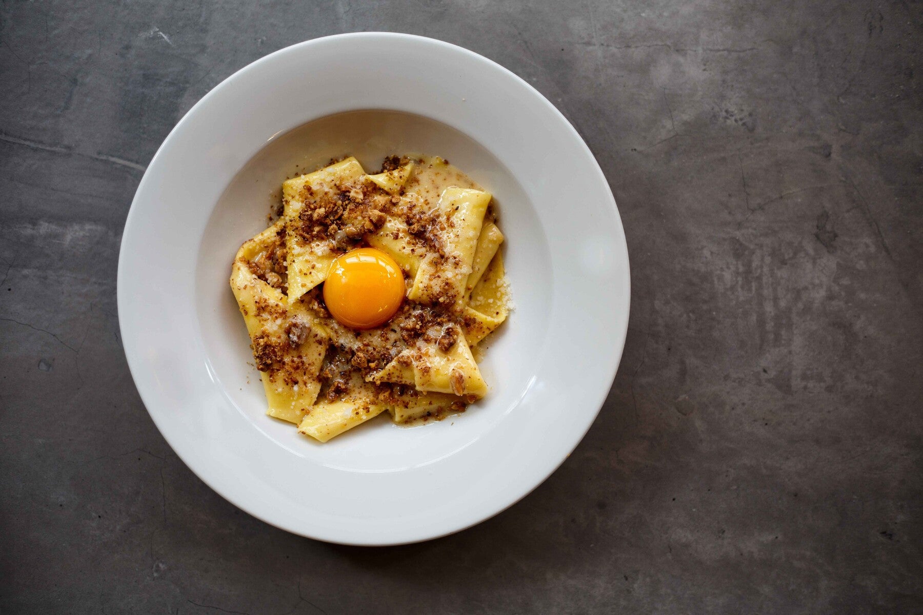 Bancone’s silk handkerchief pasta with walnut butter and confit egg yolk remains the dish most associated with the group
