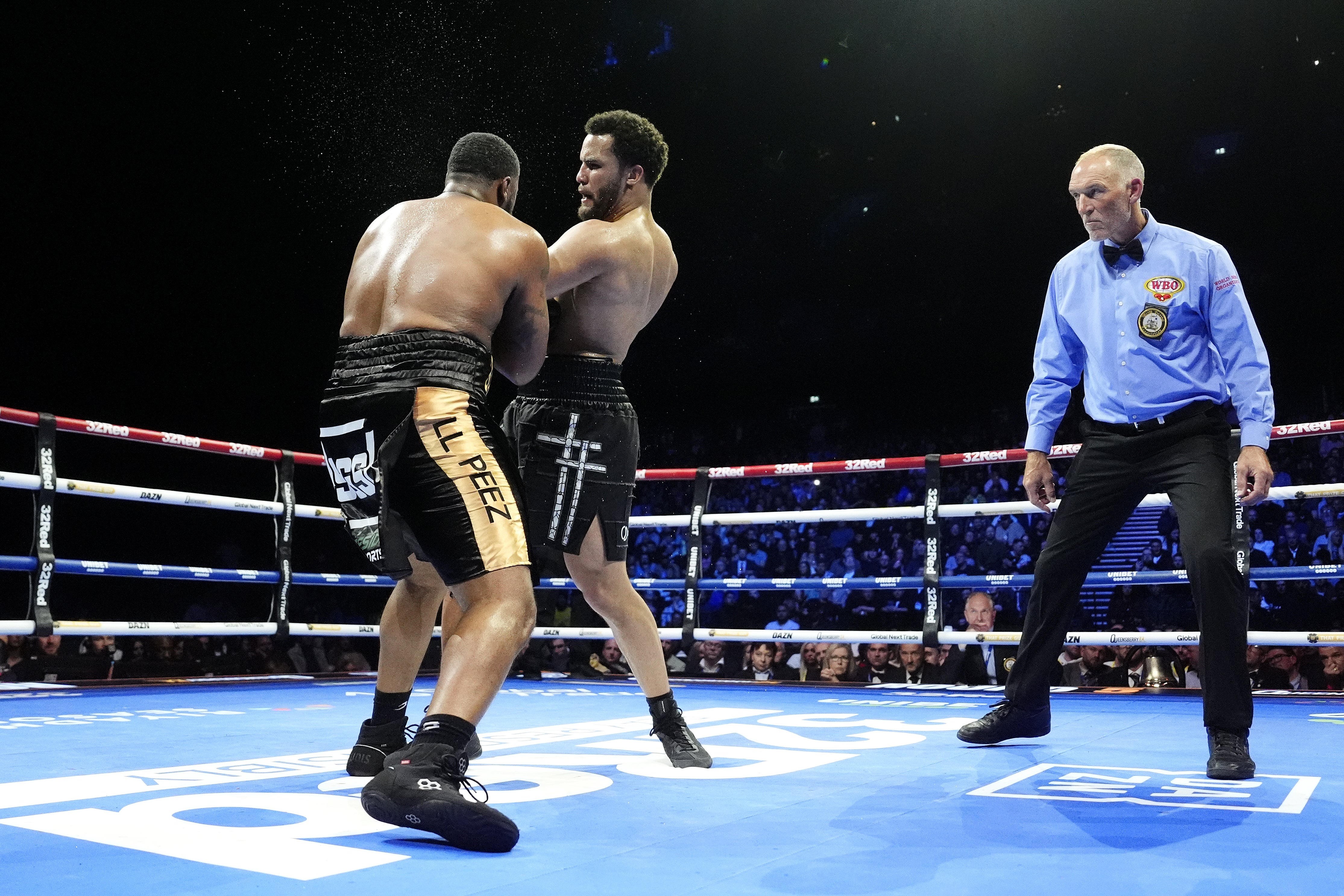 Moses Itauma, centre, knocks down Jermaine Franklin (Nick Potts/PA)