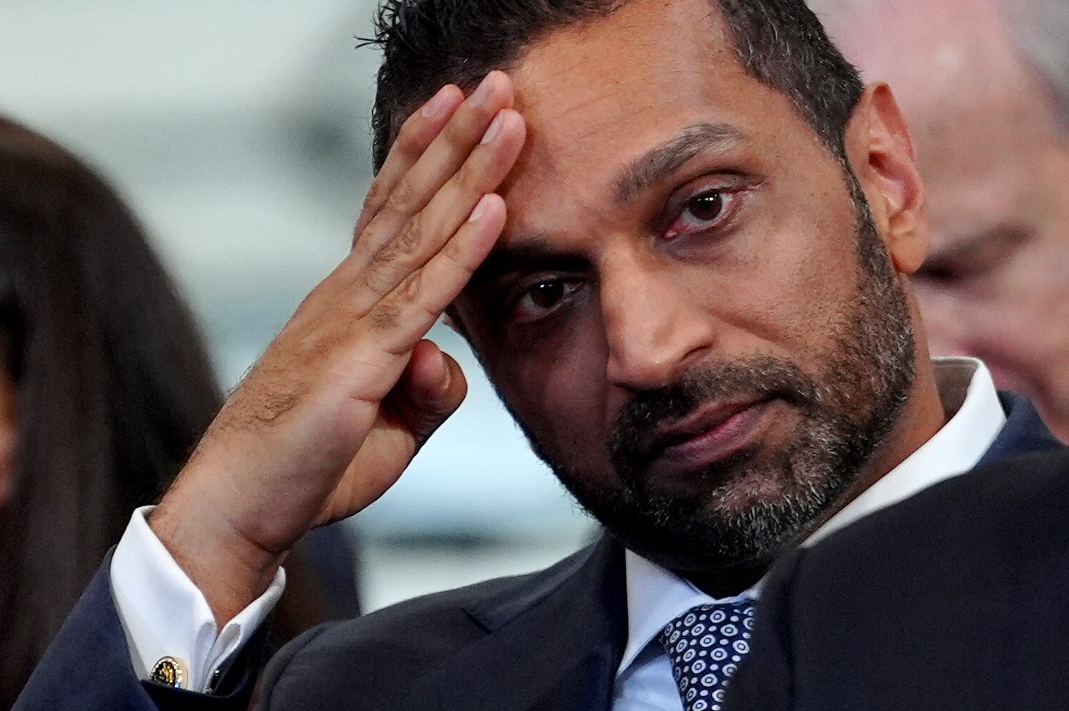 FBI Director Kash Patel listens as President Donald Trump speaks at the David Mack Center for Training and Intelligence, Friday, Aug. 14, 2026, in Garden City