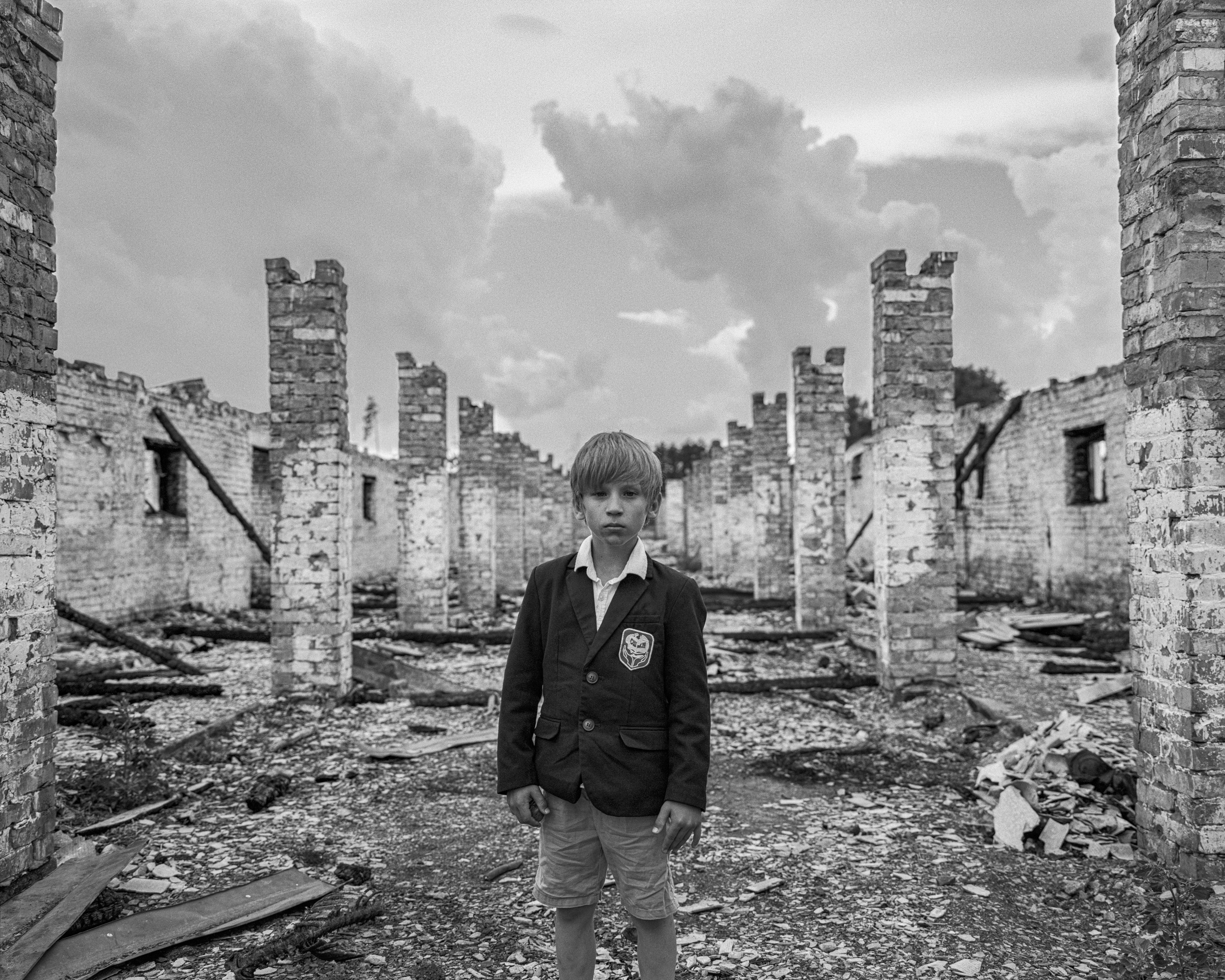 Harry chose ‘Schoolboy, destroyed farm, Kyiv region’ October 2022’ by Mark Neville for the exhibition (Mark Neville, courtesy of Postcode Ukraine/PA)