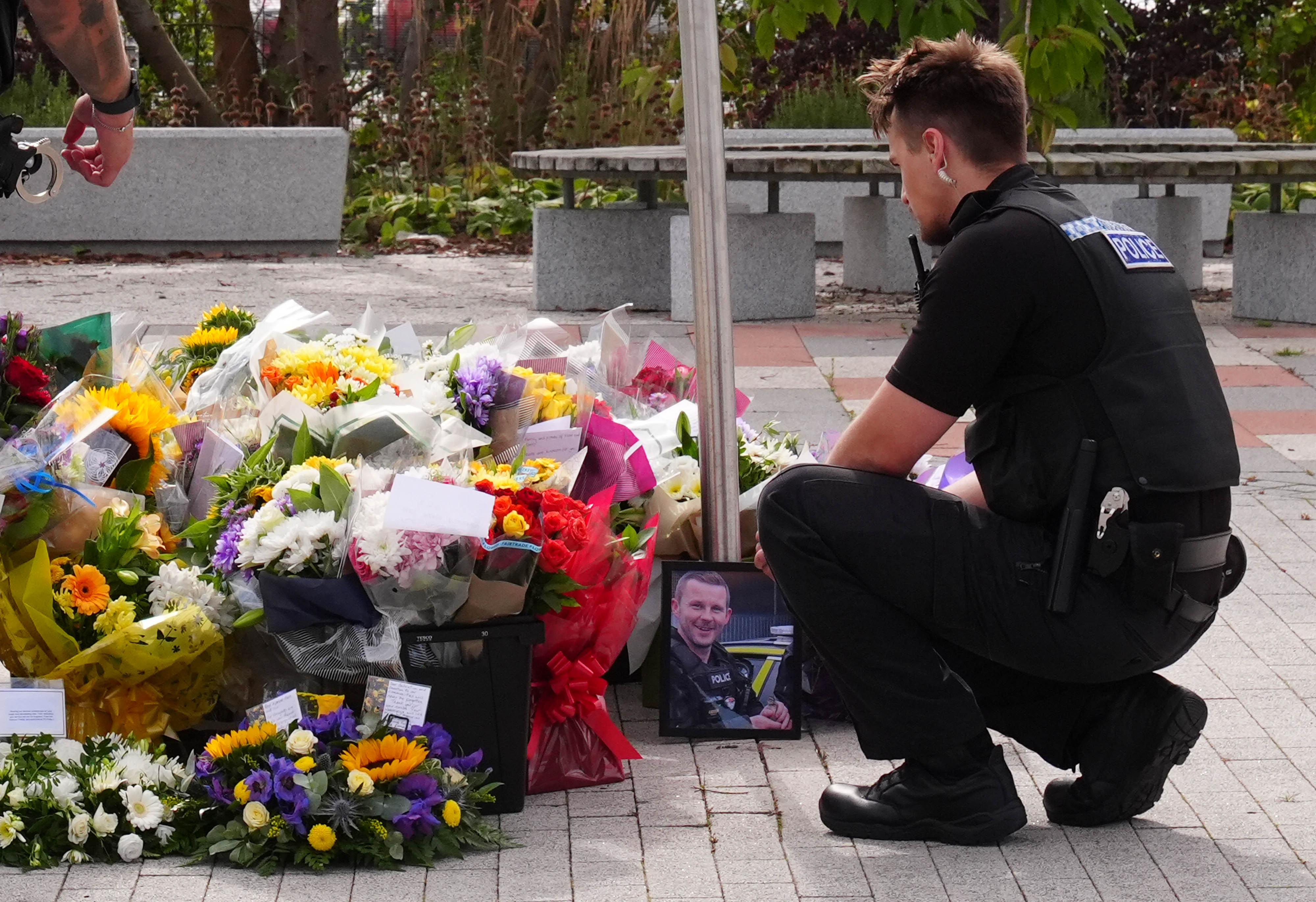 Flowers were laid in tribute to PC Matthew Blades and PC Tom Clough
