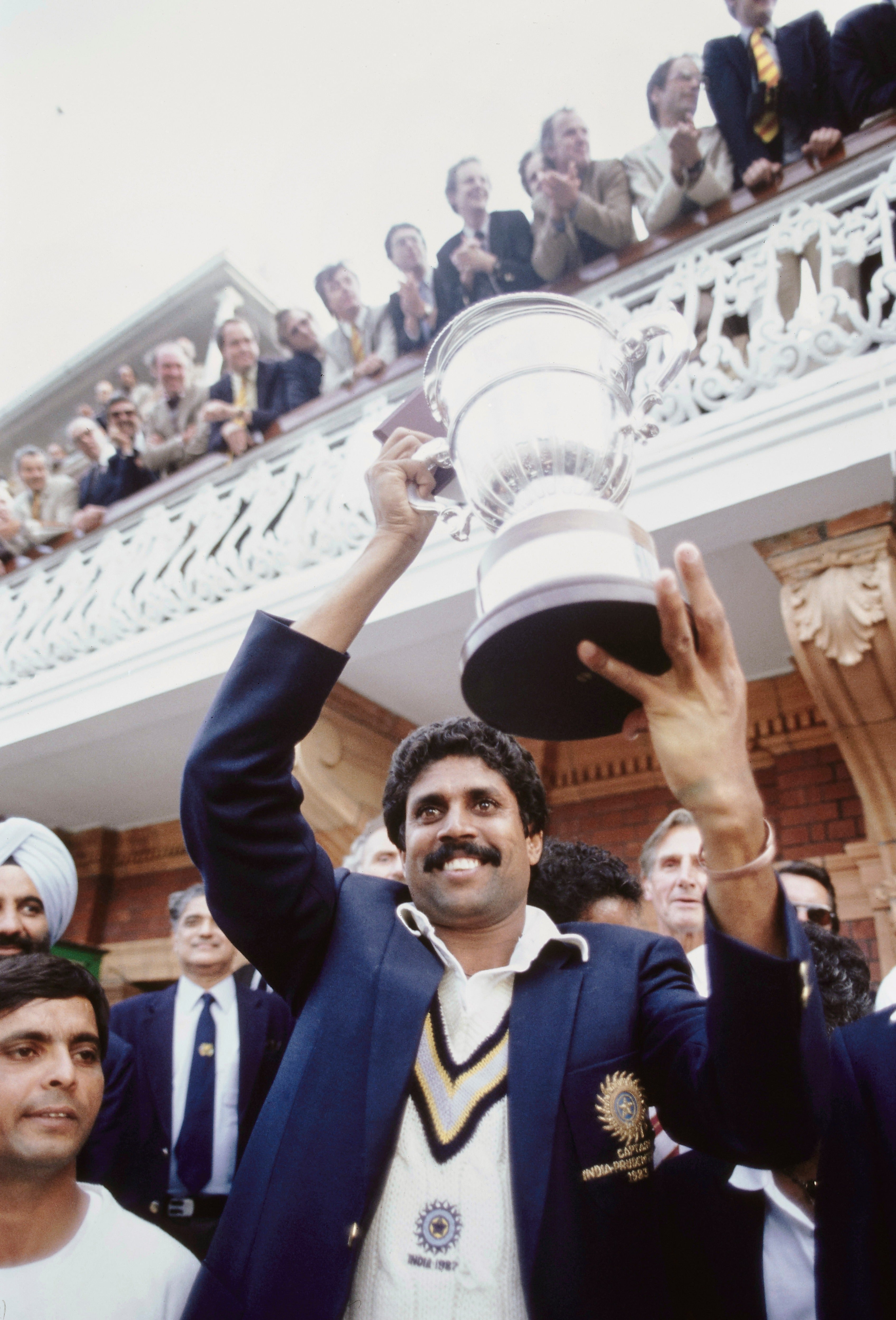 India all rounder Kapil Dev holds aloft the trophy on the balcony after the 1983 Cricket World Cup final  at Lords (Hulton Archive)