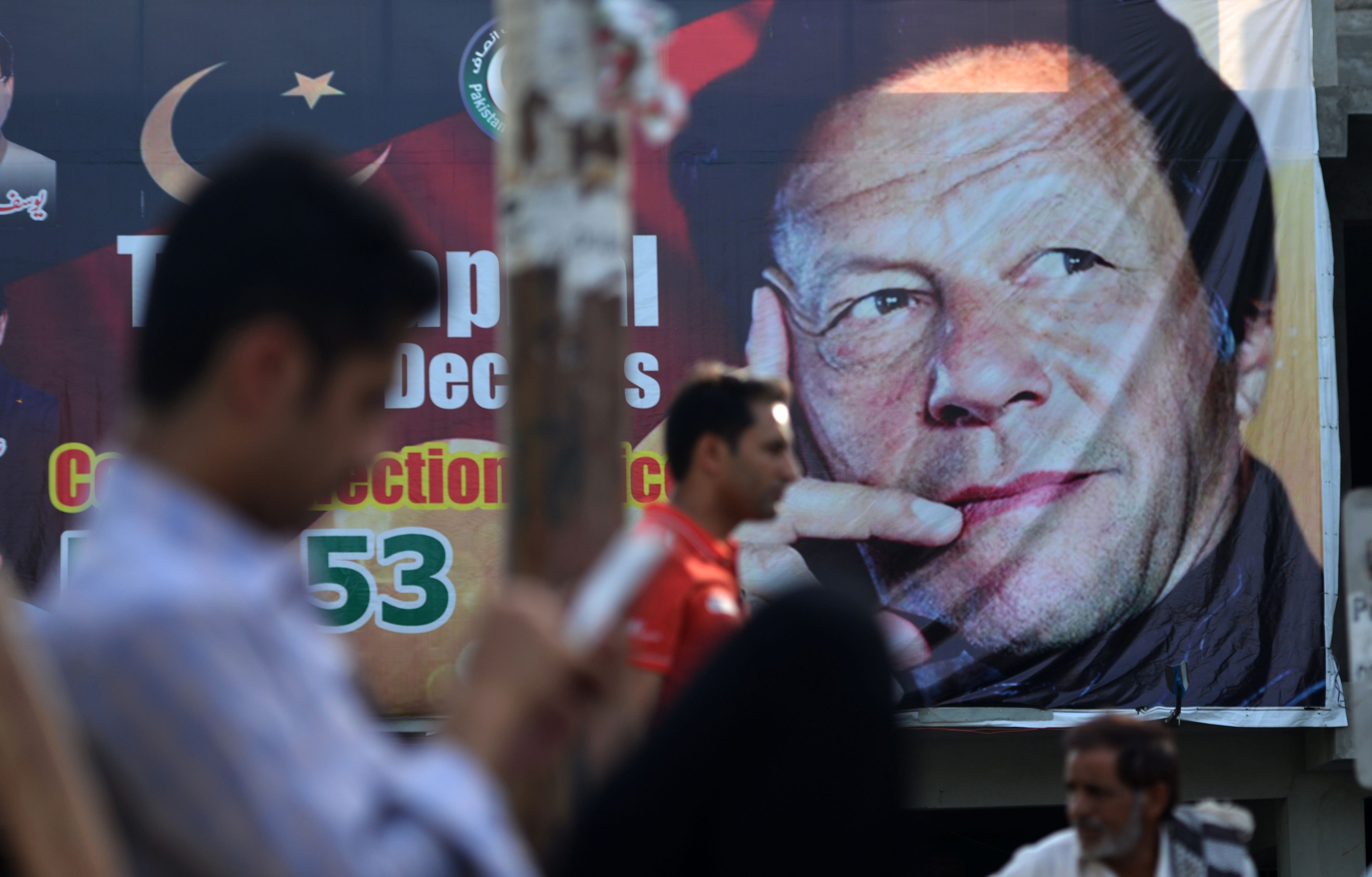 A poster of jailed former prime minister Imran Khan in Islamabad on 30 July 2018 (AFP/Getty)