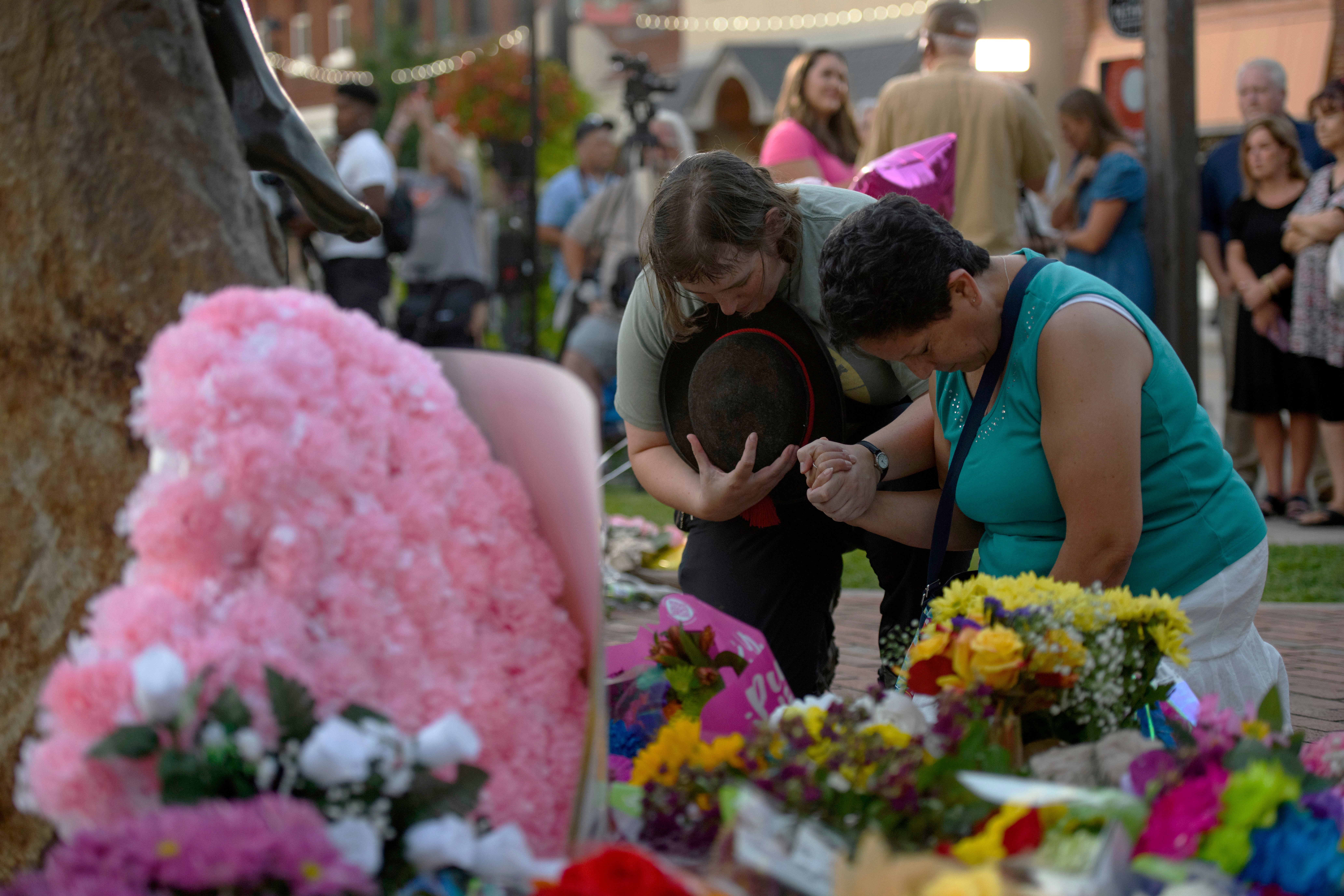 Fans pay tribute to Dolly Parton at her statue situated on the lawn of the Sevier County Courthouse in Sevierville, Tennessee